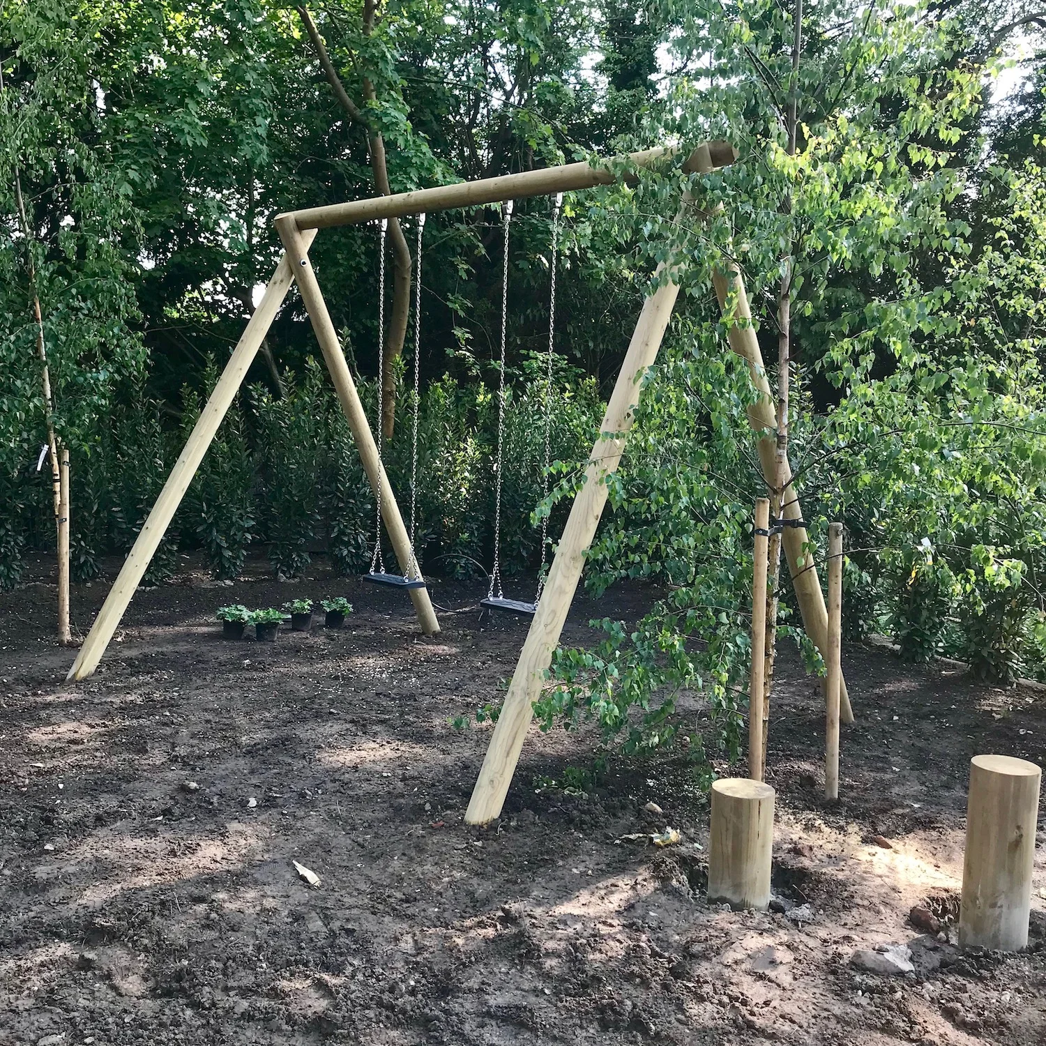 "...garden swing set in landscaped garden"