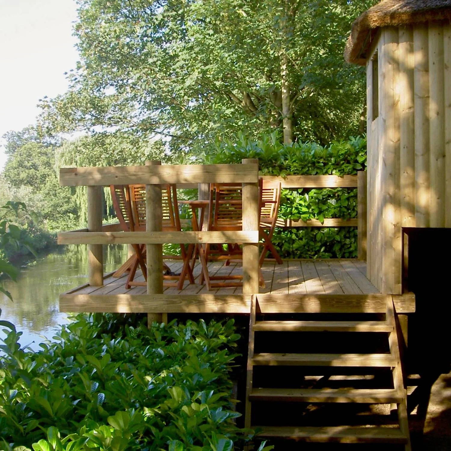 "...treehouse deck looking out over river"