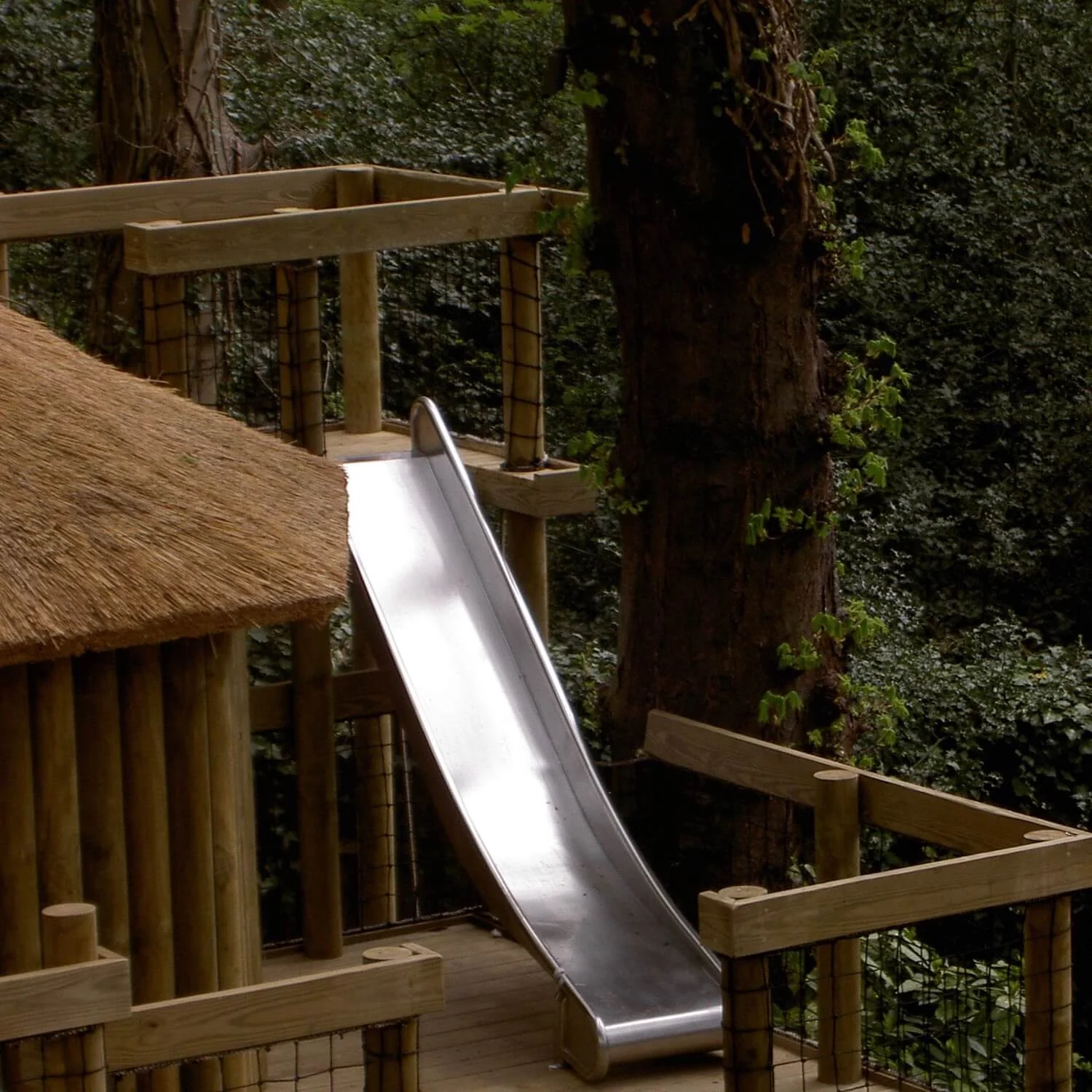 "...treehouse slide between play decks"