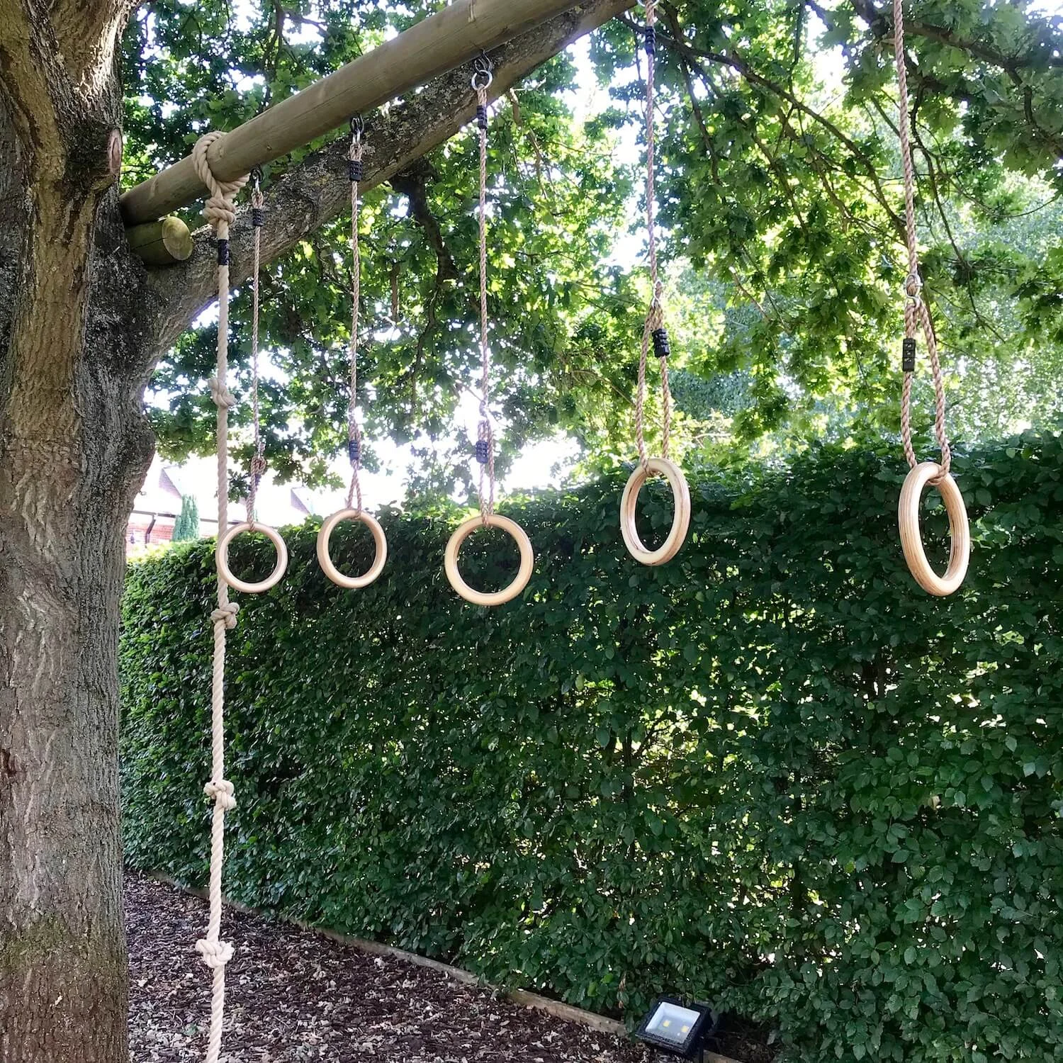 "...timber monkey holds from beam"