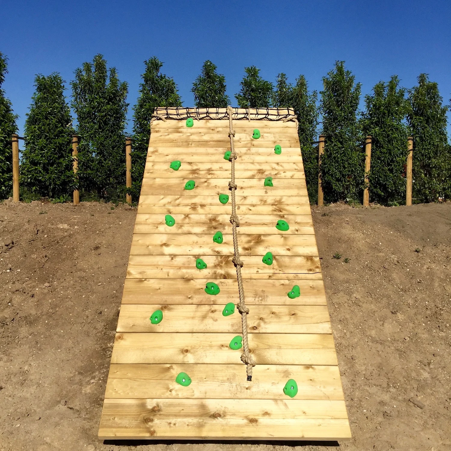 "...big ground based climbing wall on garden slope"
