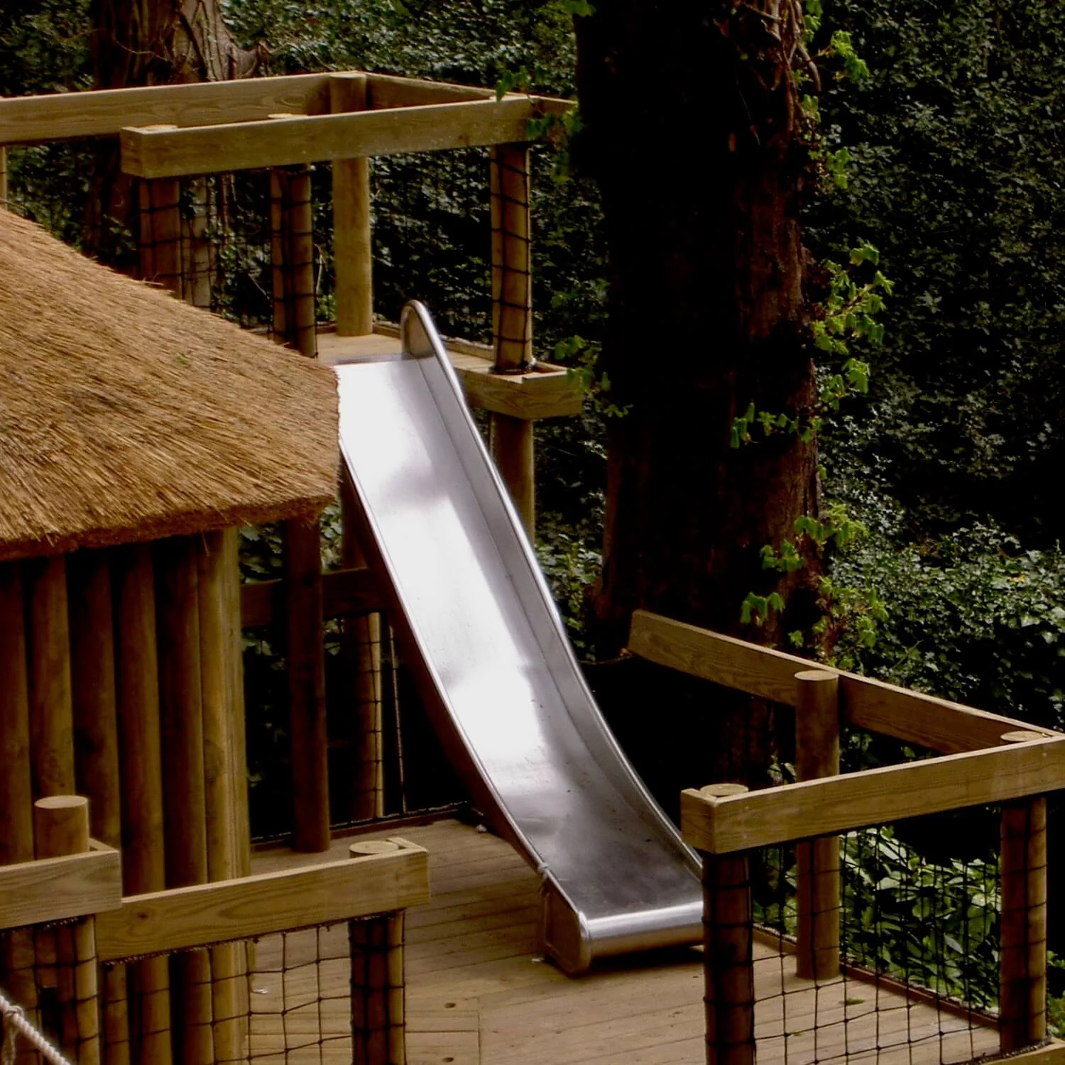 "...slide between treehouse decks"
