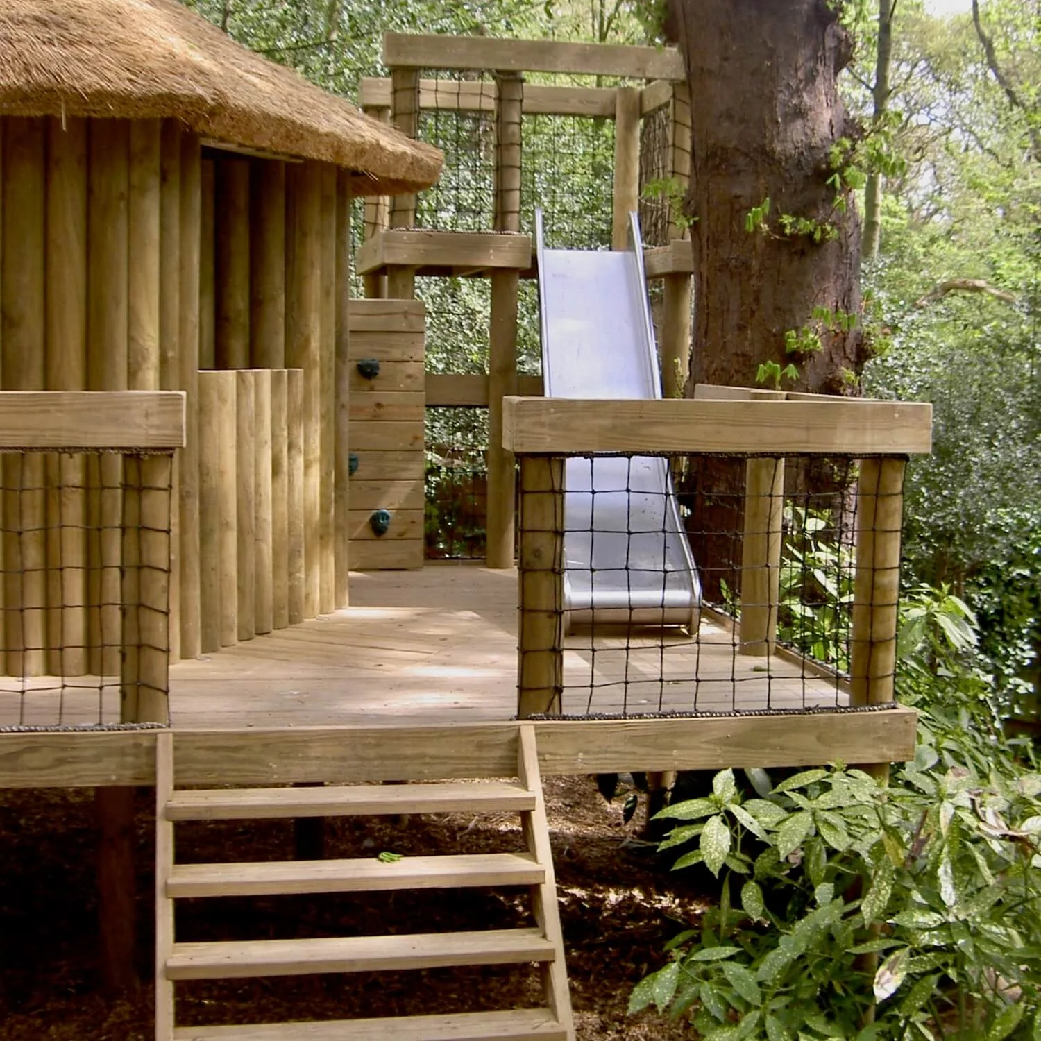 "...treehouse slide between decks"