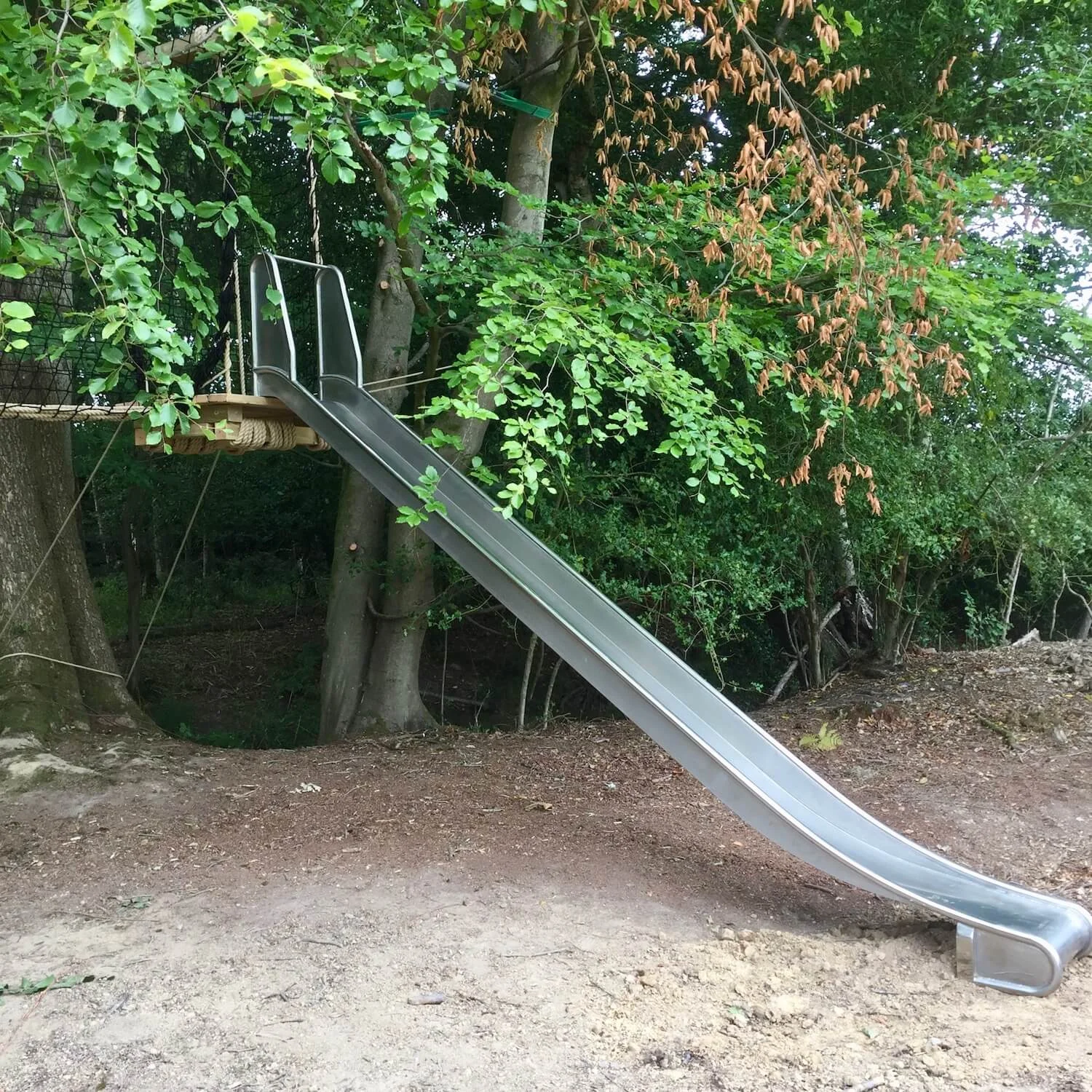"...slide from a floating suspended deck"