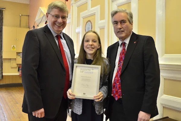 Source: Point of light; Pictured Grace Warnock receiving her award for her invisible disability campaign