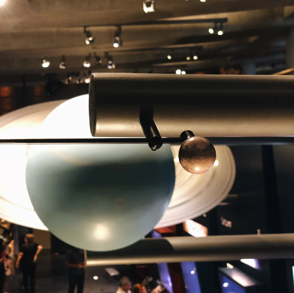  This model is in the larger expansion wing beneath the main lawn of the observatory. We watched a pretty fascinating film hosted by Leonard Nimoy about the construction of it. One really awesome thing to point out about this model of Pluto is they u