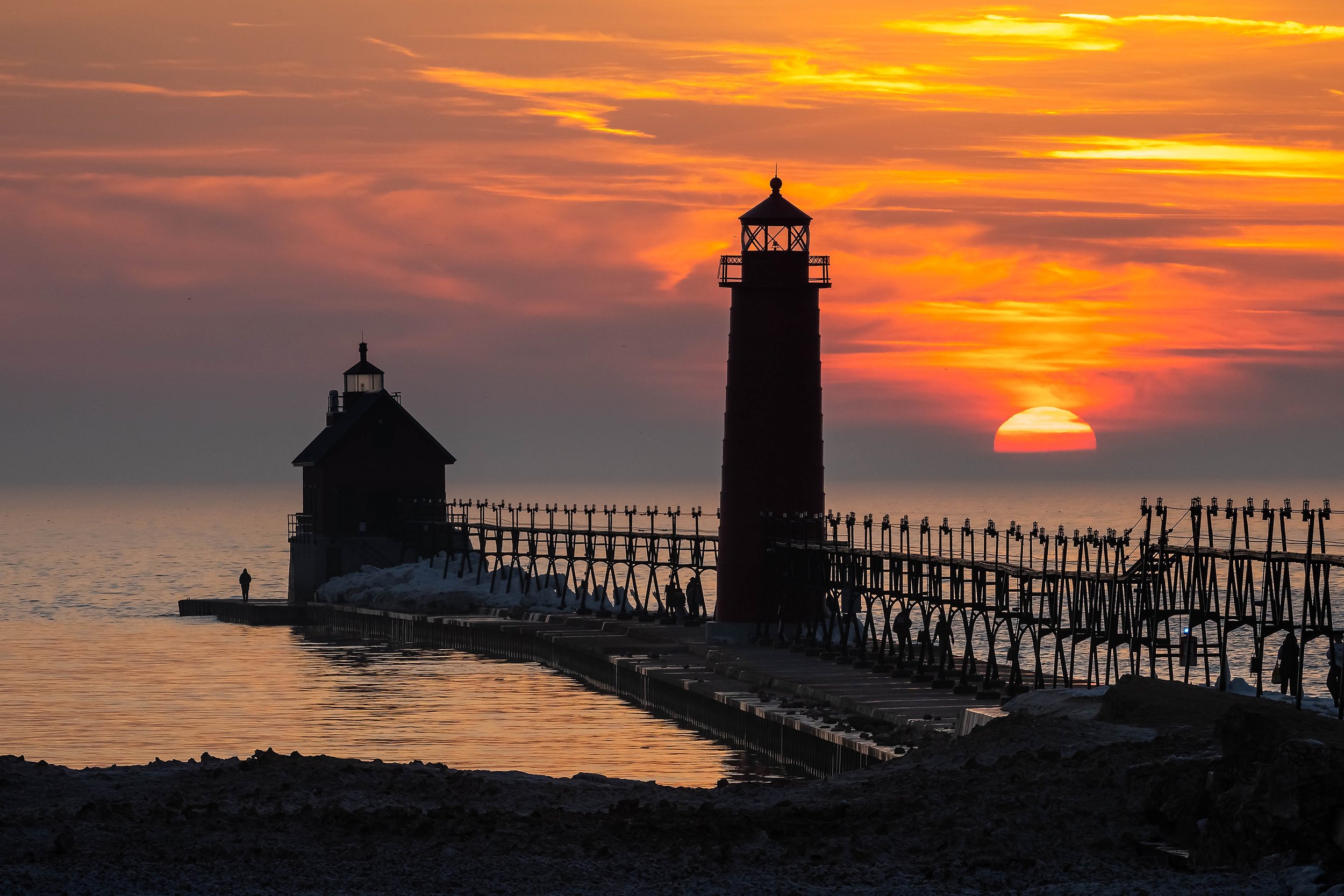  Silhouette of the Grand Haven Lighthouse as the sun sets. 