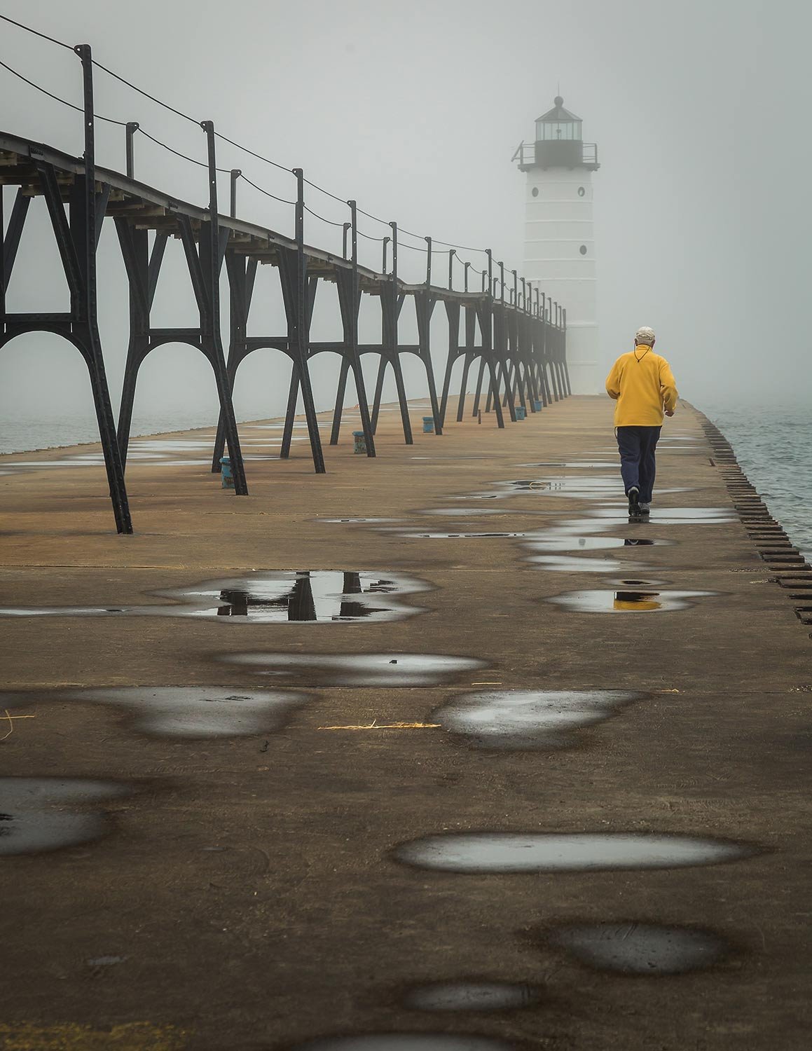  The early morning jogger in the fog at the Ludington Lighthouse 