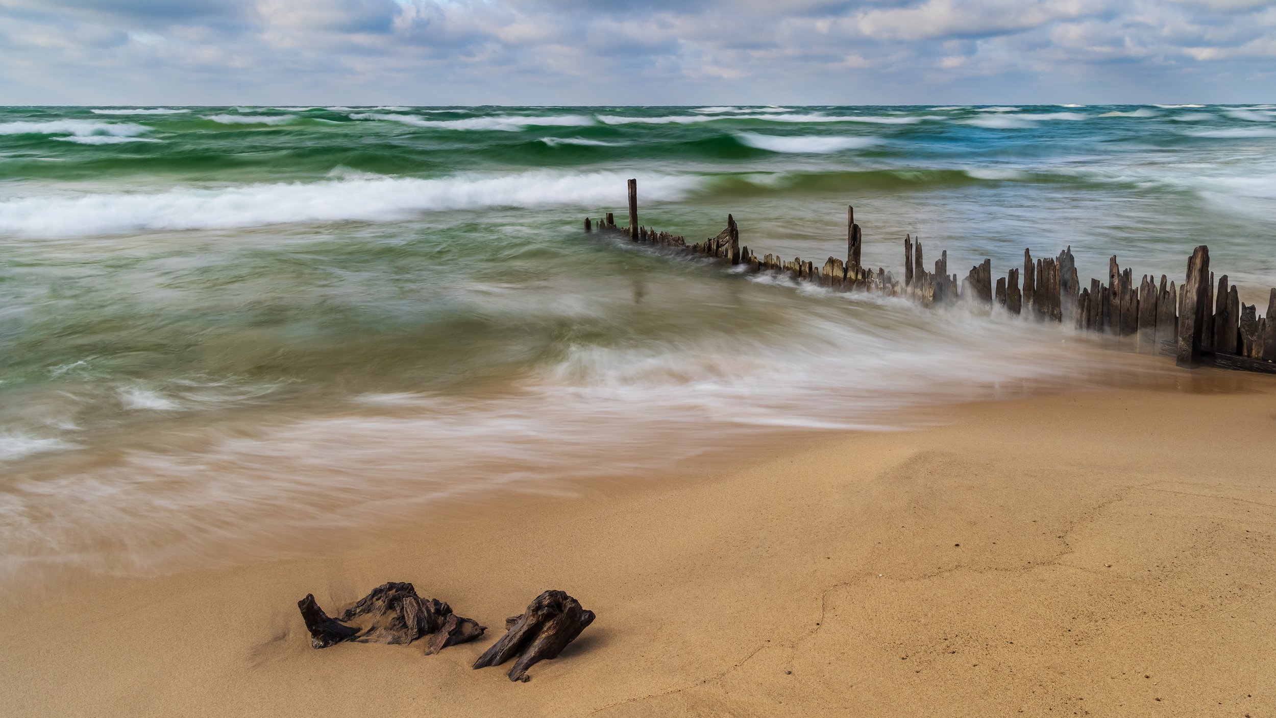  Old dock remains on a Lake Michigan beach 