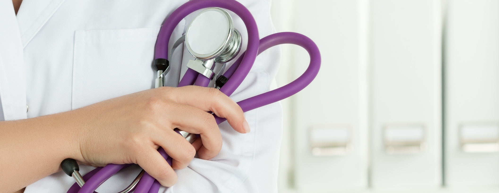 Image: Female doctors's hands holding stethoscope