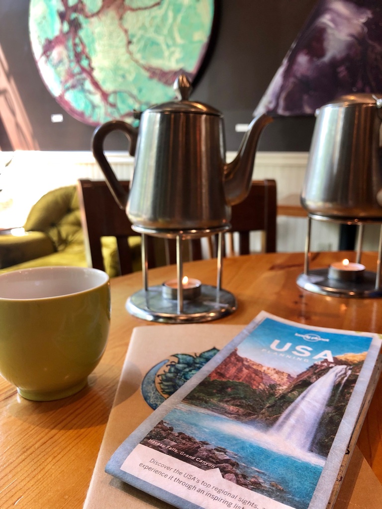 Planning the next few days of our trip with a free pot of tea from townshends thank you punch card