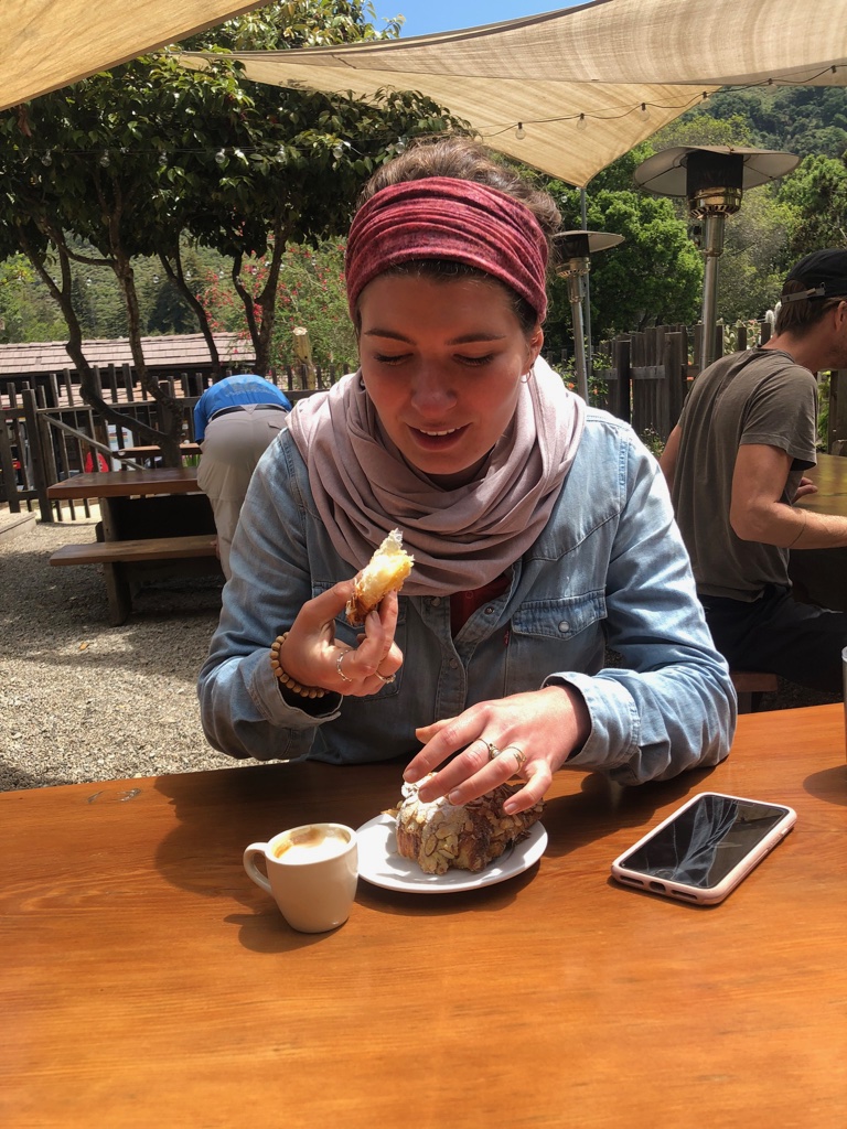 Emma thoroughly enjoying her croissant