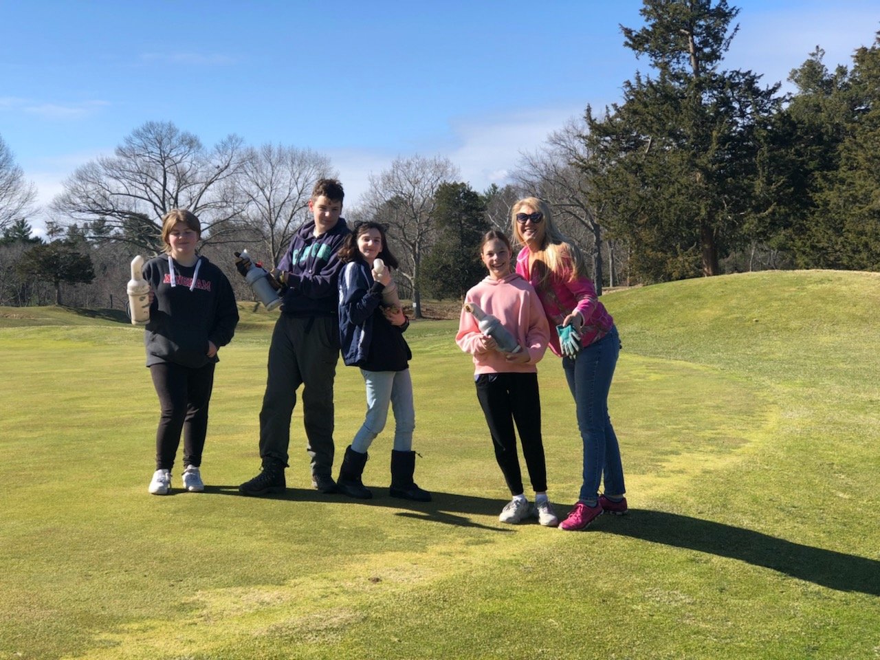 FSSCC board member, Trina Ott leading a group of volunteers repairing divots!