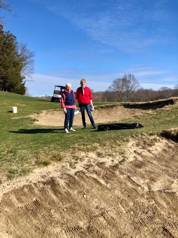 Volunteers Jinx Flynn and Mary Yucobian cleaning up the bunkers