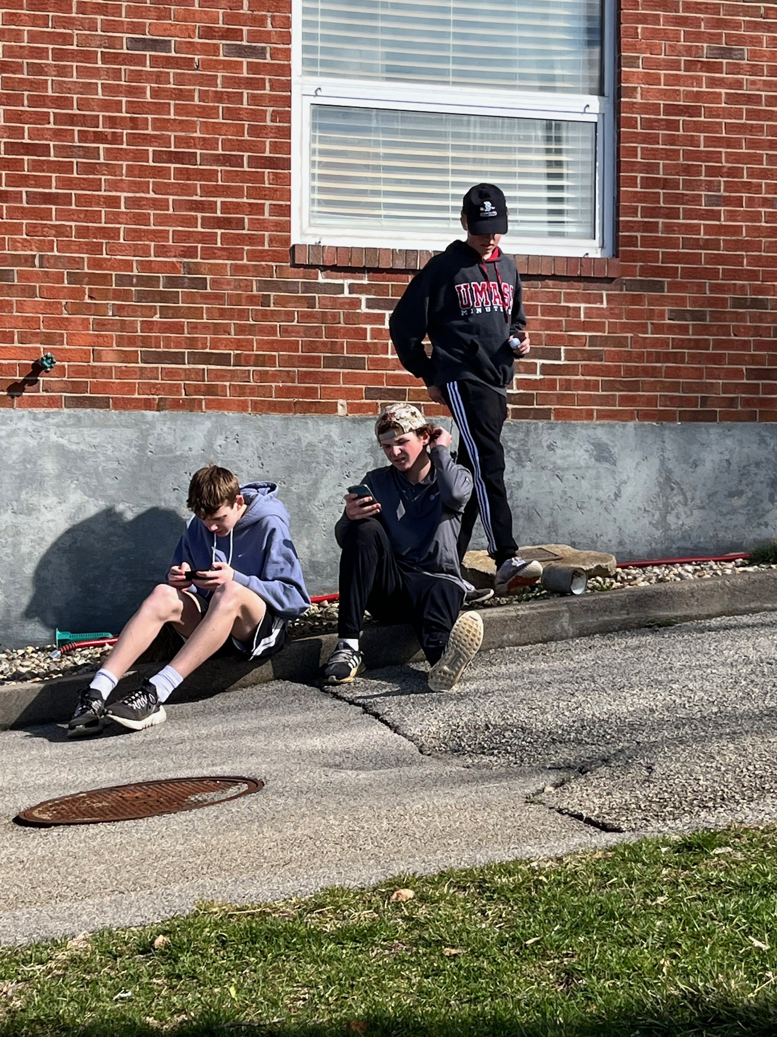 Members of the Hingham High School Boys golf team take a break from volunteering