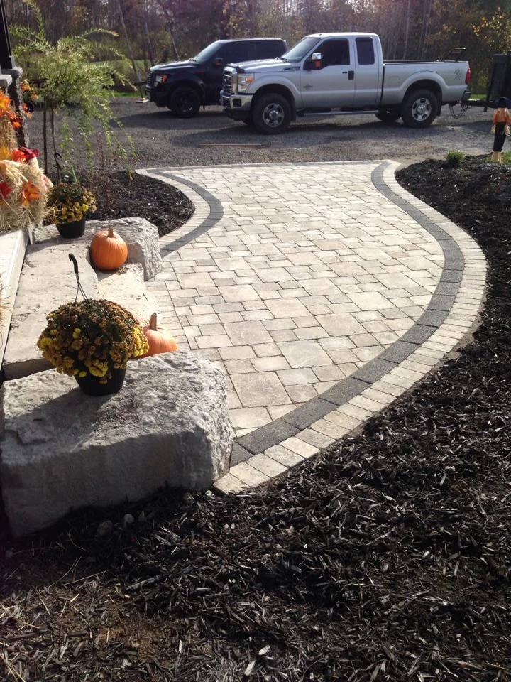An Elegant Modern Grand Entrance Done With Our Strada Antico Grey And Strada Ultra Black In-Lay Paver 