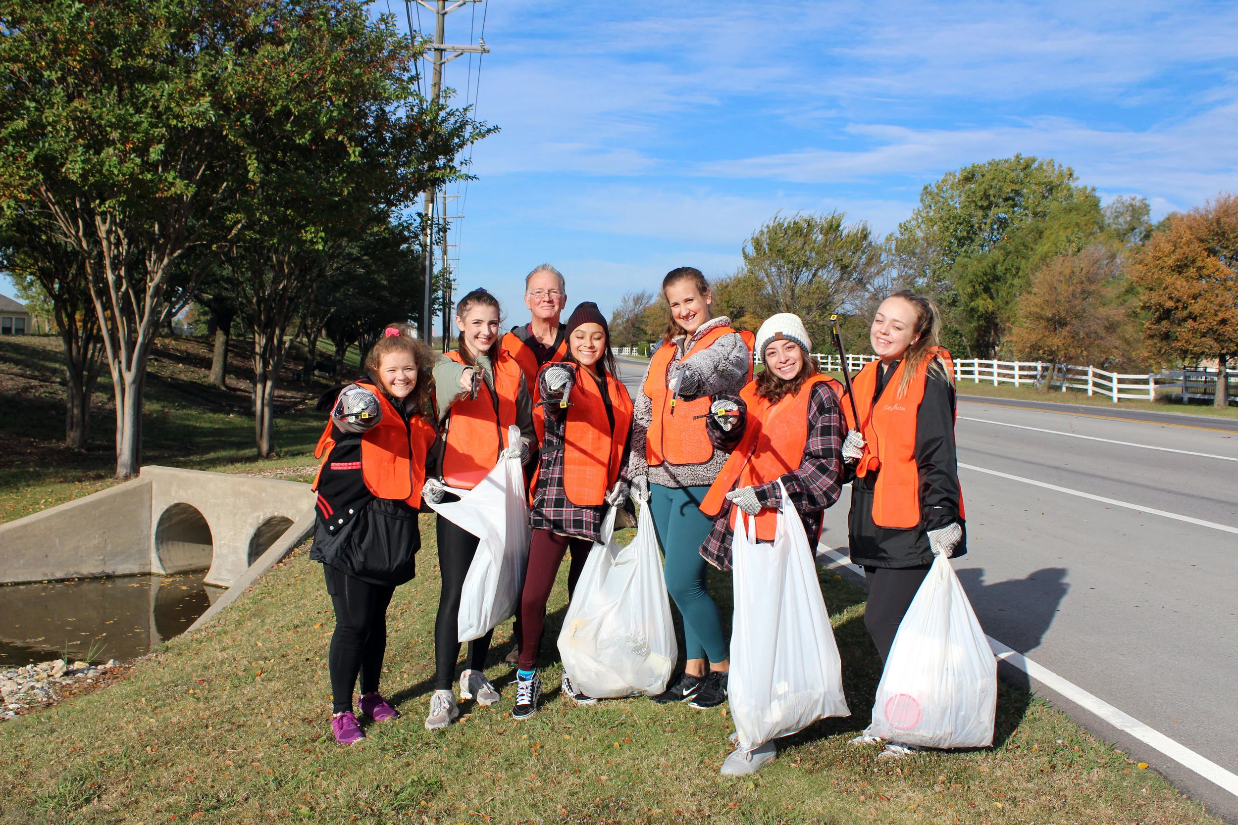 City of Lucas employee Jim Hurley accompanied members of the Lovejoy High School Majestics dance team while they cleaned up Lucas Road. (from left) Lyndsey Toft, Sophie Shay, Melannie Montalvo, Grace Guzinski, Debbie Montalvo and Meghan Maxwell.