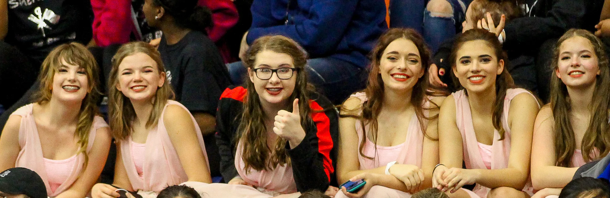 LHS Color Guard team sits in the stands after performing their show Goodnight Moon
