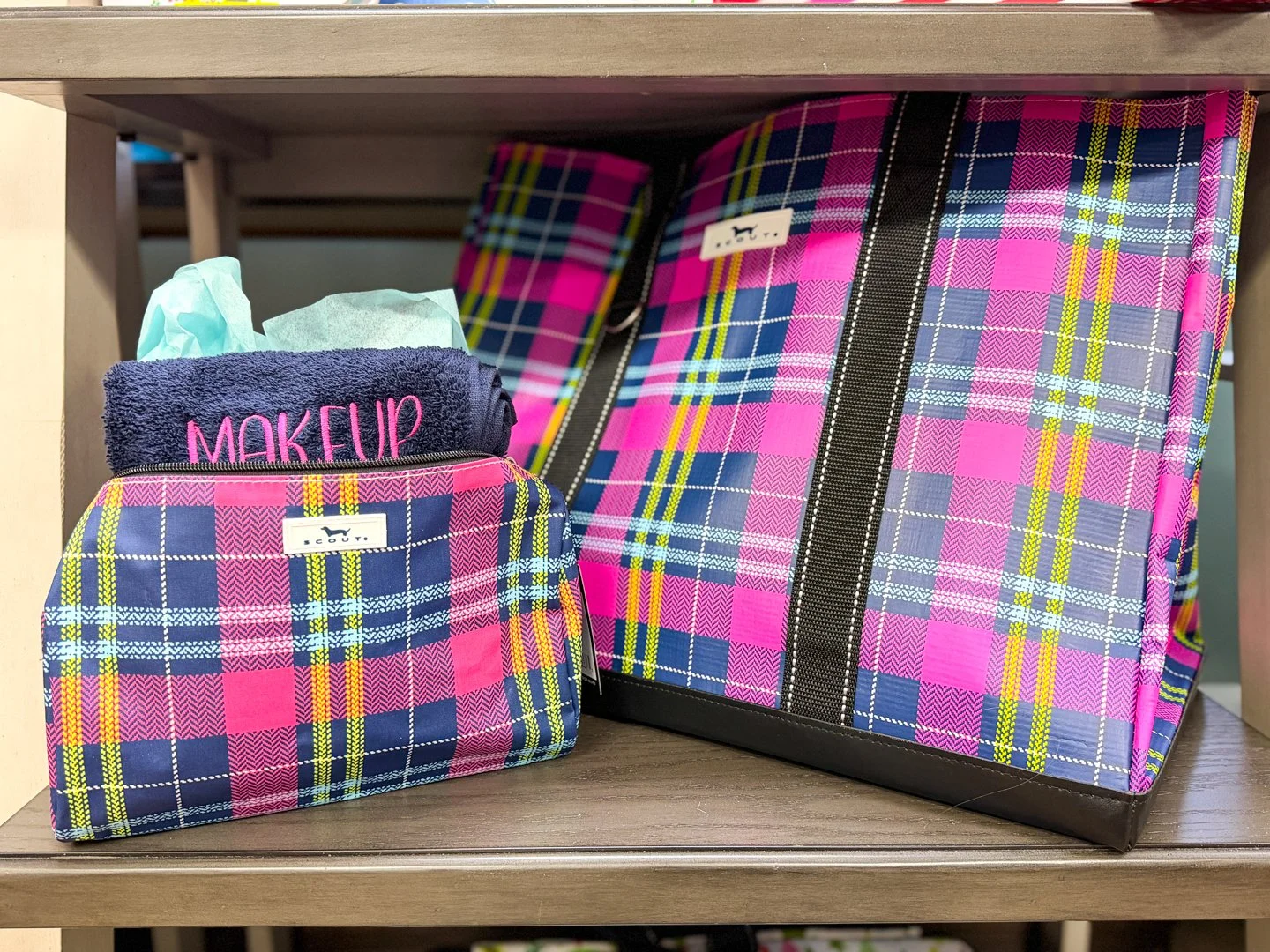 Curated collection of SCOUT makeup bags and tote bags in pink and navy plaid