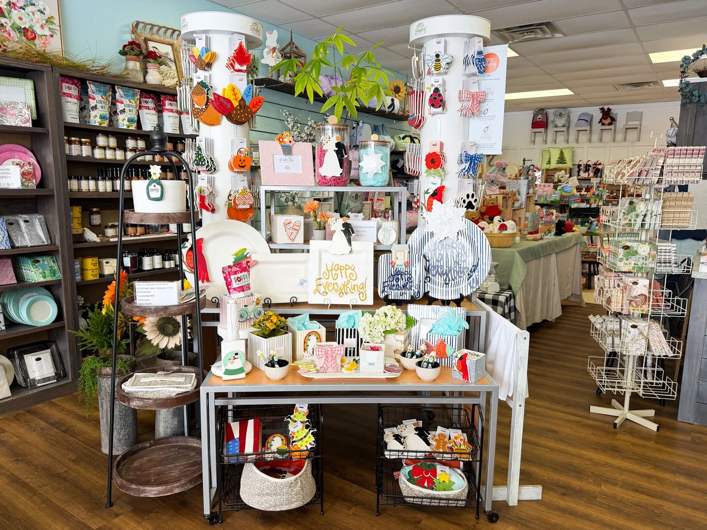 Curated display of local artisan crafts, home decor, seasonal gifts, and boutique accessories