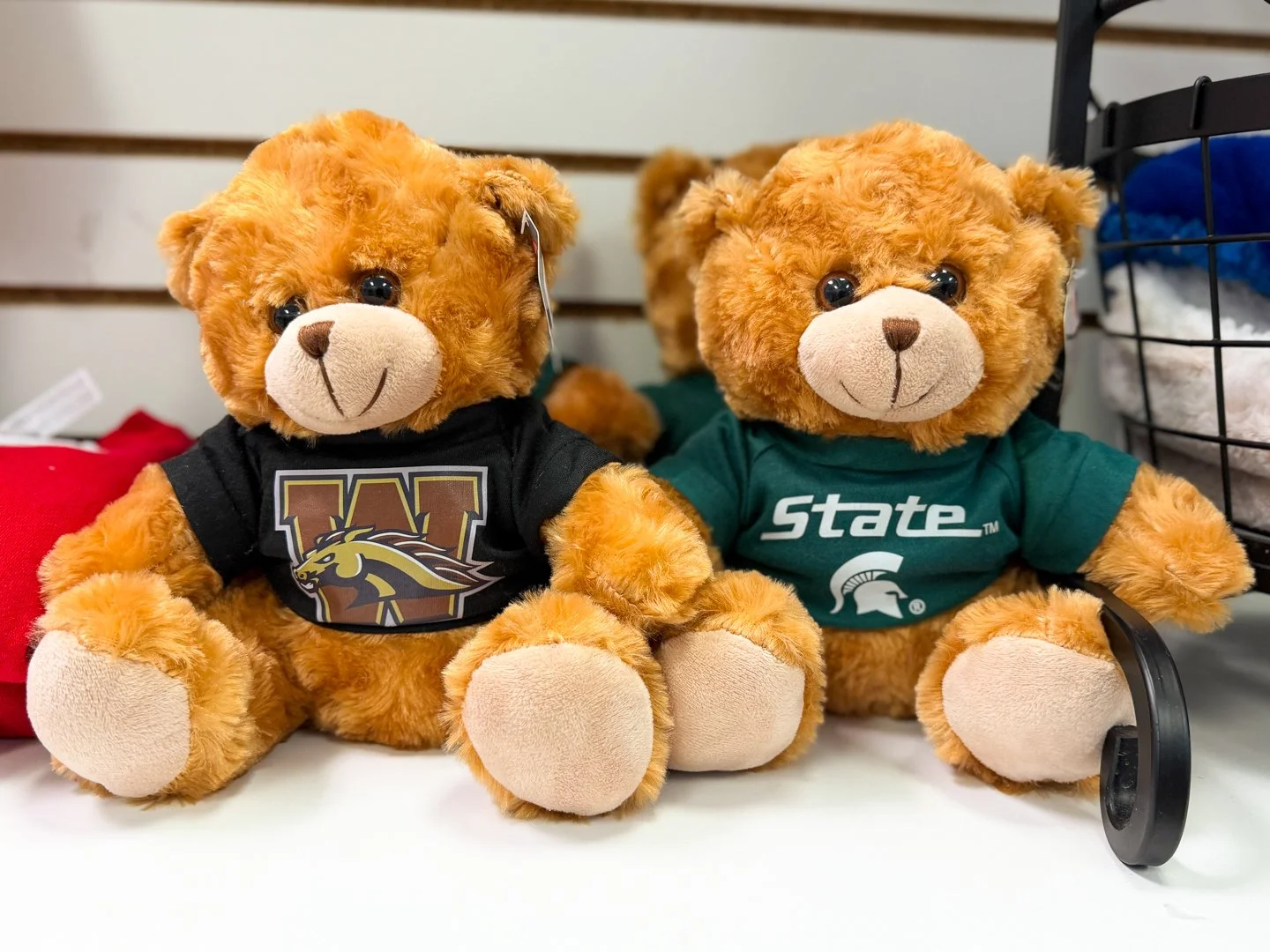 Custom collegiate plush bears featuring Western Michigan University and Michigan State University