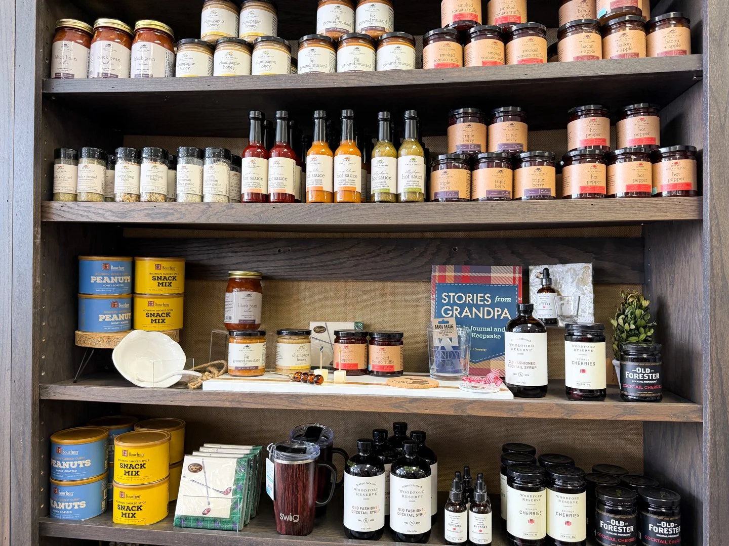 Curated gourmet pantry gifts, featuring Salt Sisters infused salts, Old Forester cocktail provisions, and artisanal snack mixes