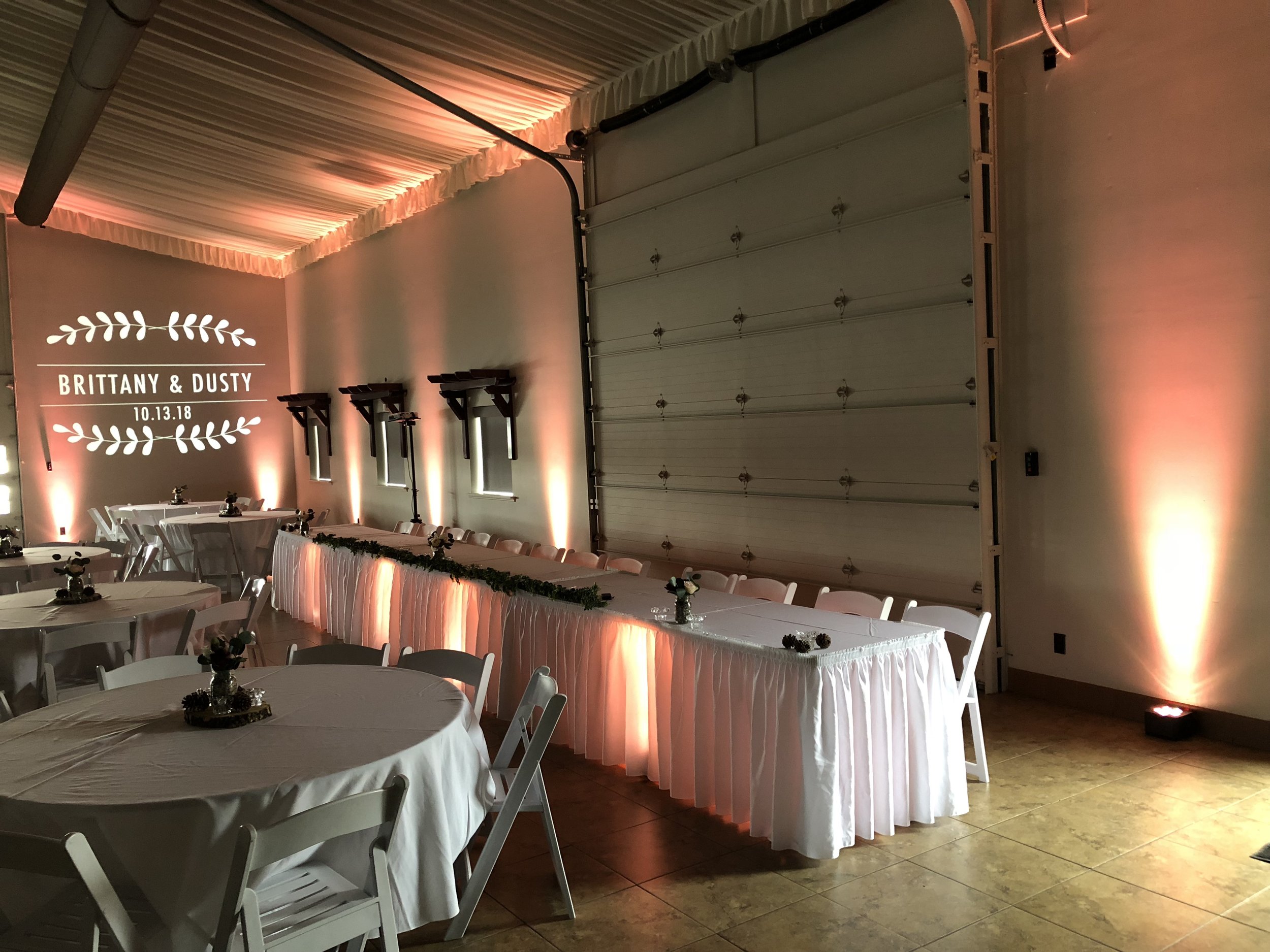 Pink wedding uplighting with monogram 