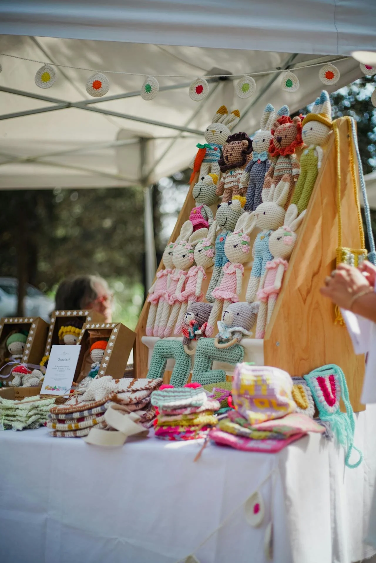 a craft fair booth with crocheted toys