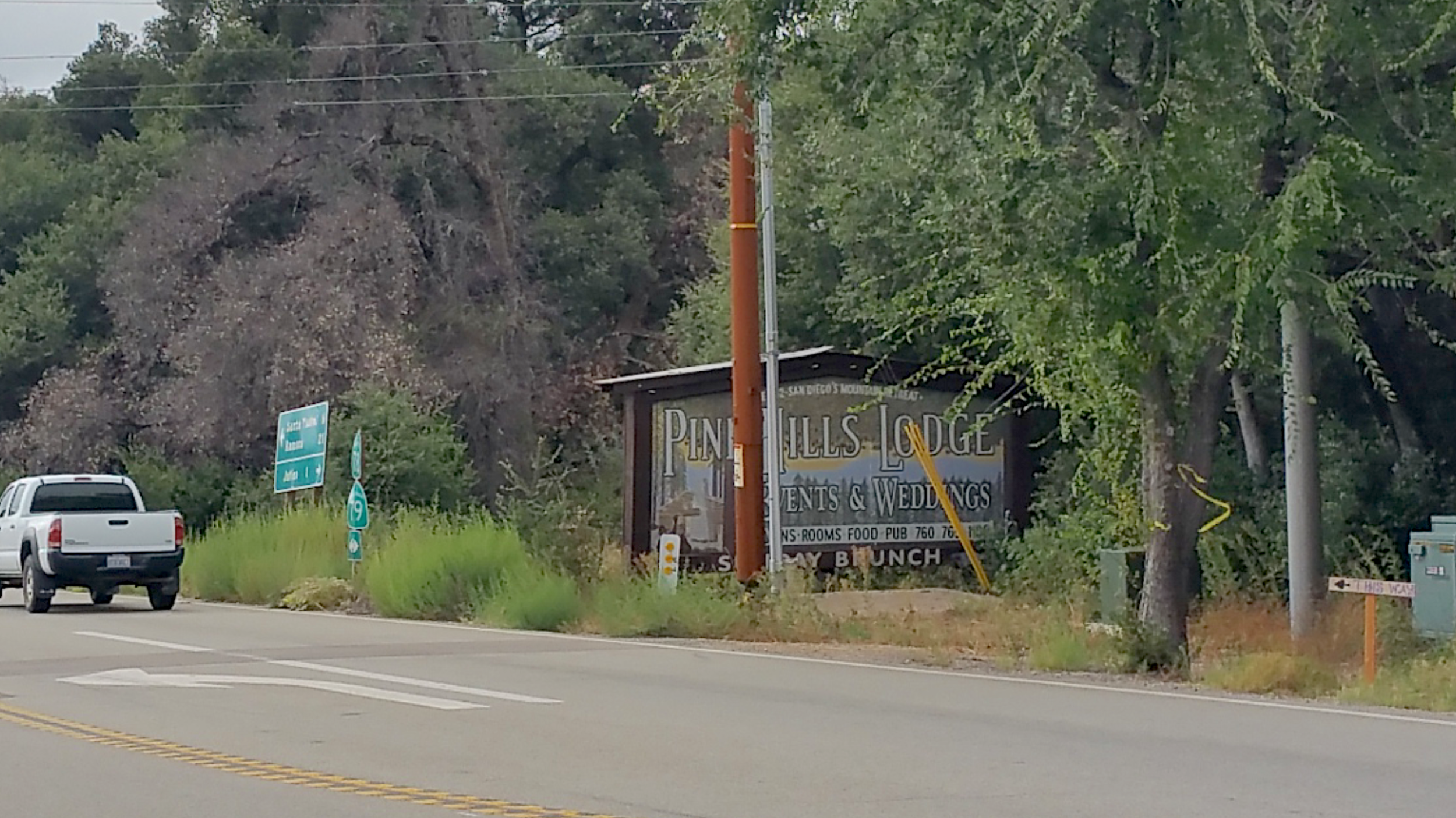 A bit of complication for my client happened when the local electric utility placed that power pole in front of the east face of the sign. The new design was adjusted for readability in this new visual environment.