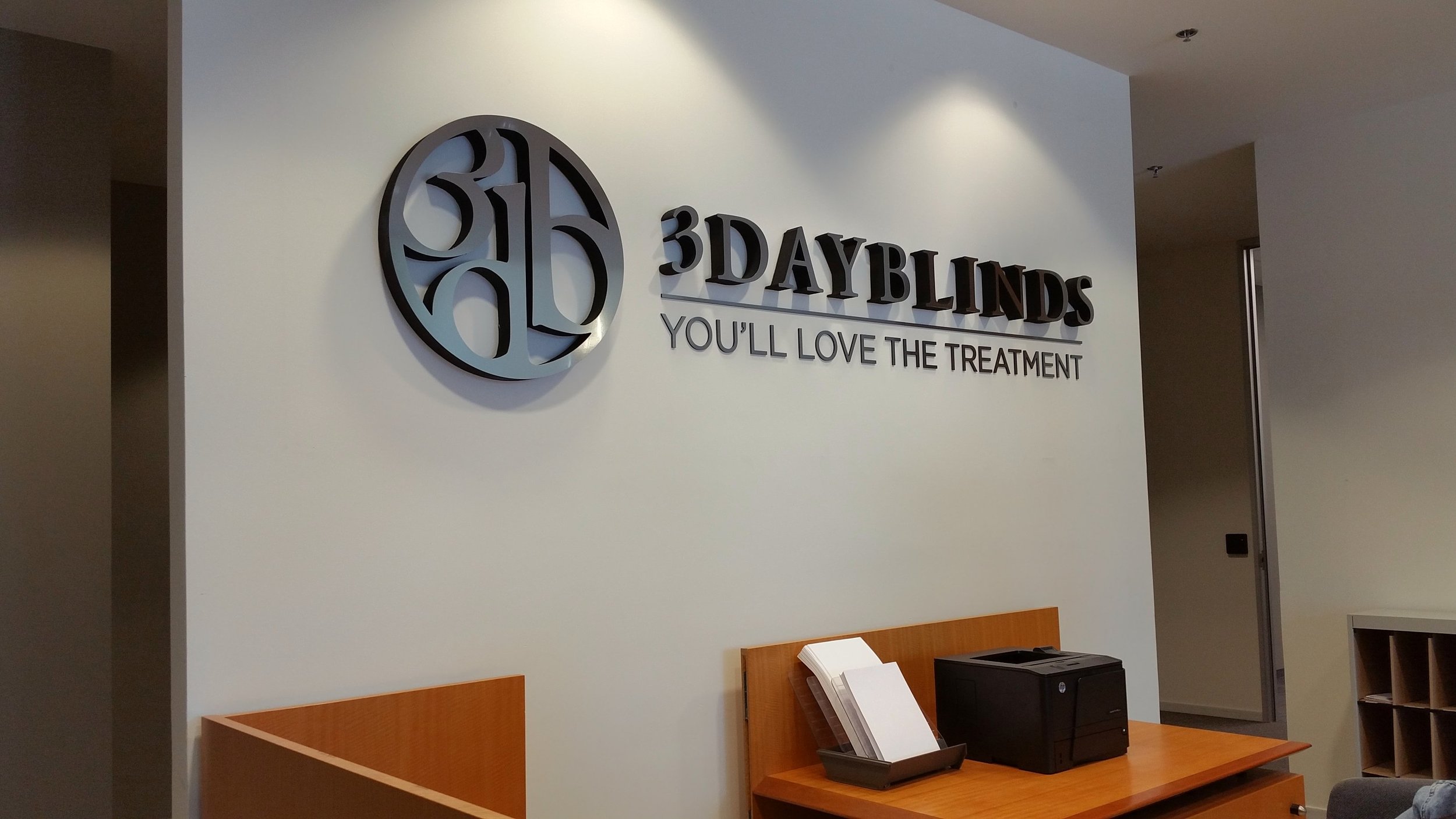 3 Day Blinds corporate reception dimensional logo