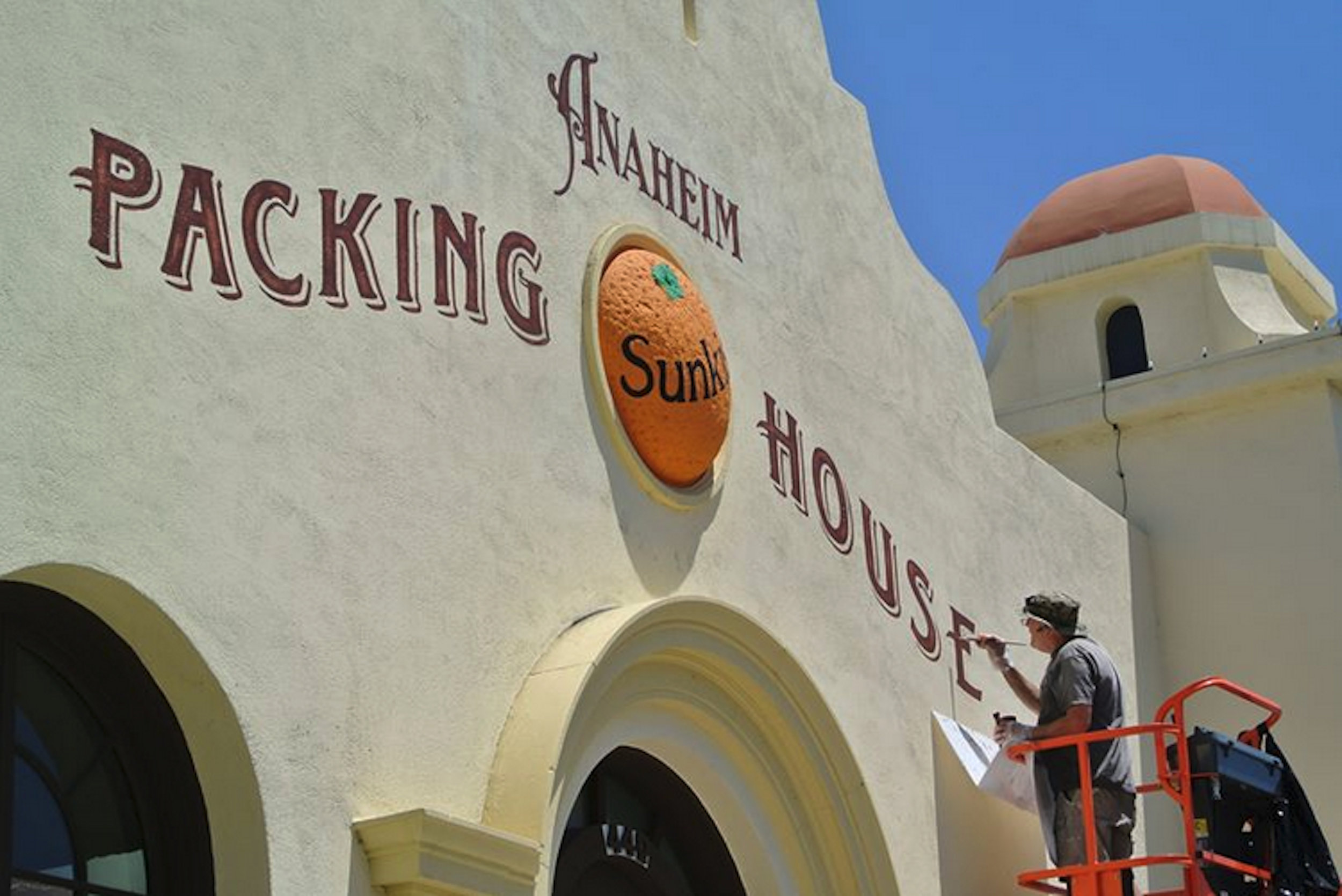 Anaheim Packing House hand lettered main sign - sign painter at work