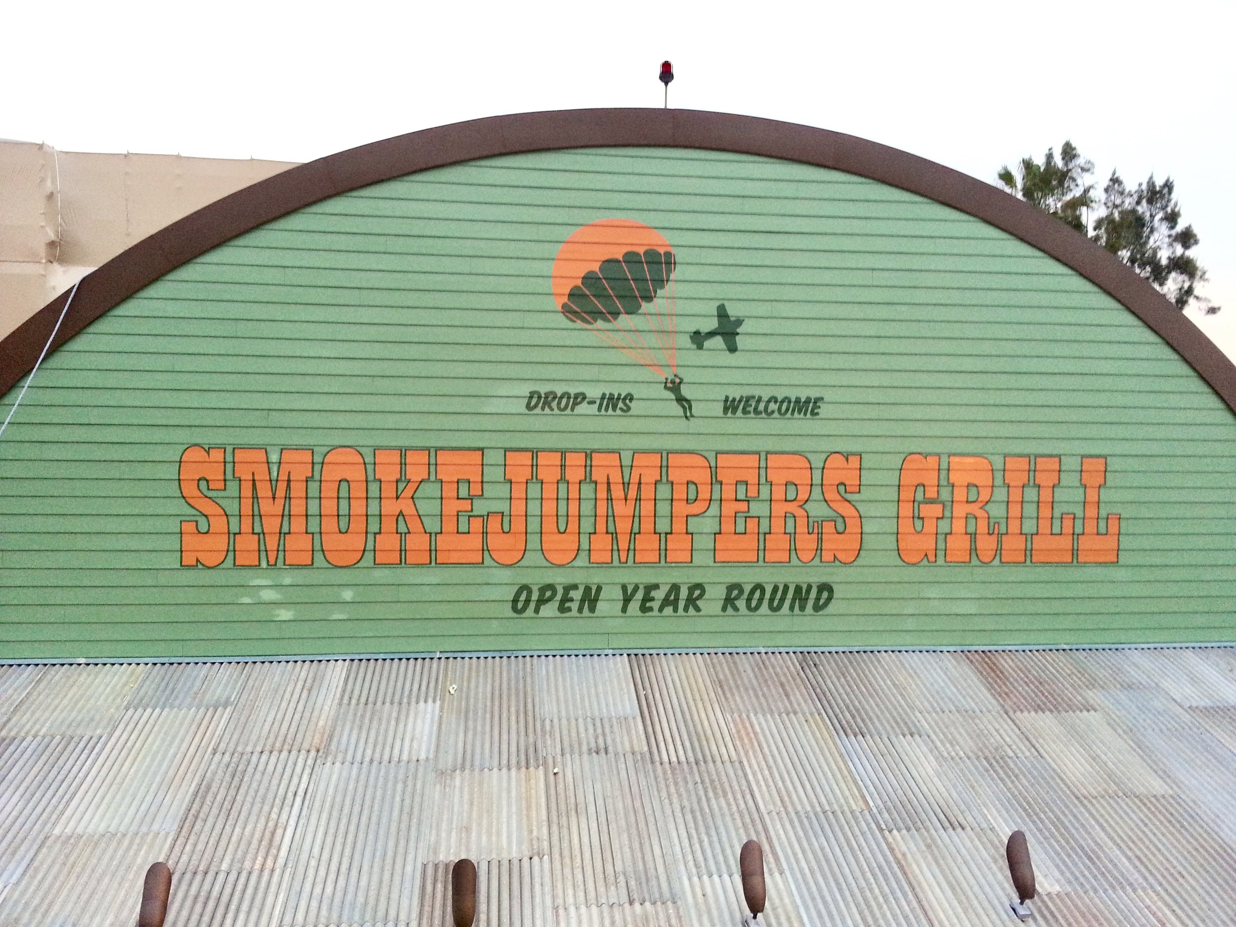 Smokejumpers Grill exterior hand painted distressed wall graphics