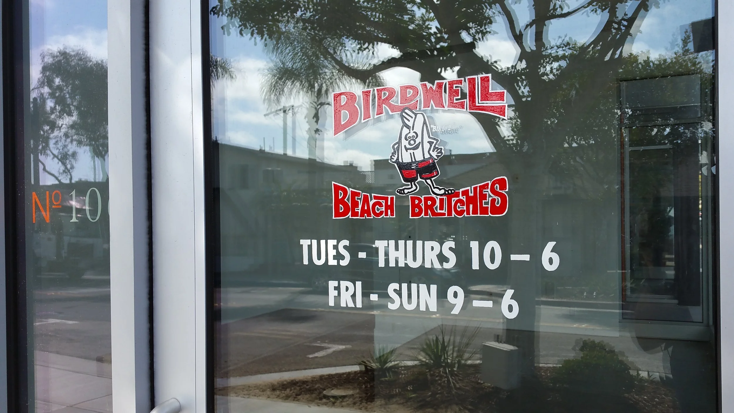 Birdwell Beach Britches hand lettered window sign detail