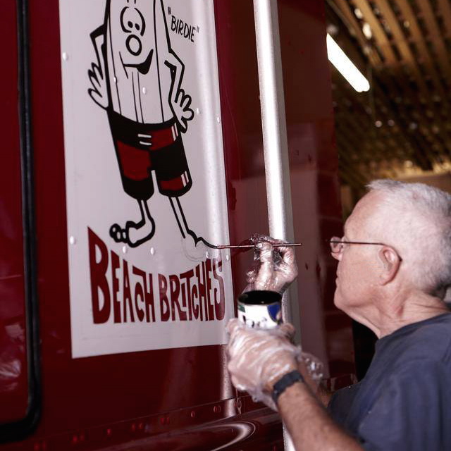 Birdwell Beach Britches hand lettered vehicle graphics - sign painter at work
