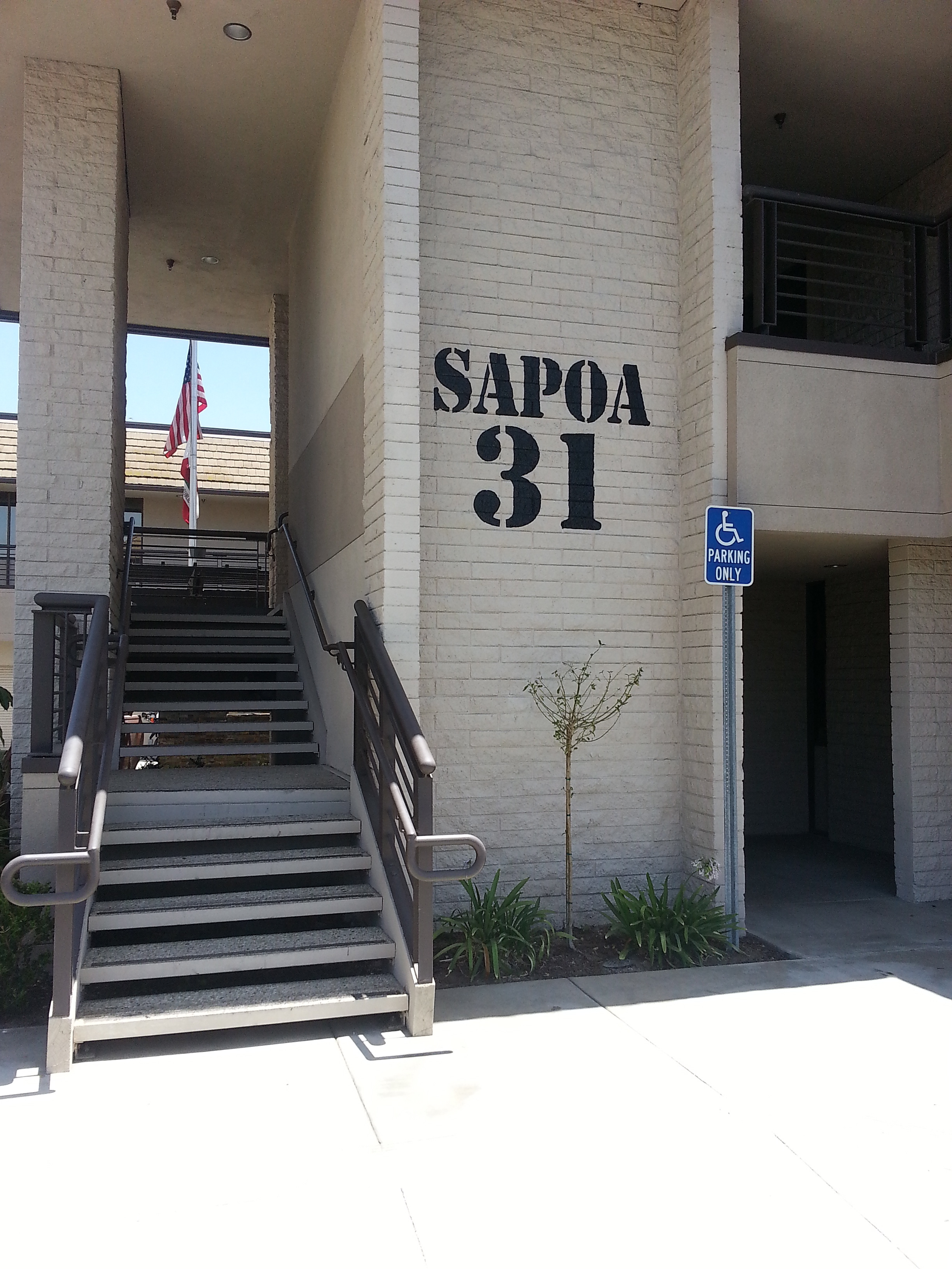 SAPOA exterior hand painted wall graphic