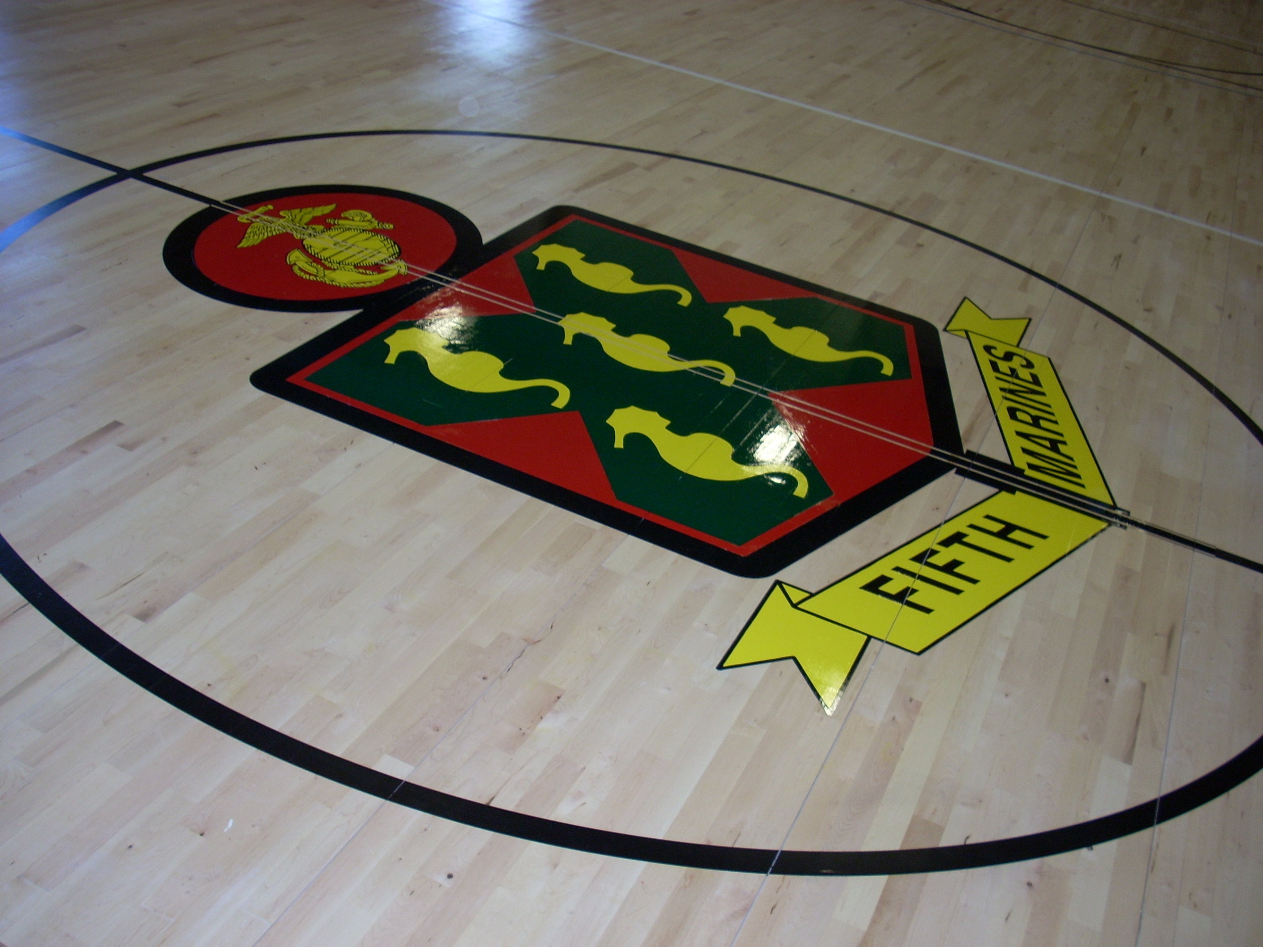 Fifth Marines gym wood floor hand painted graphics