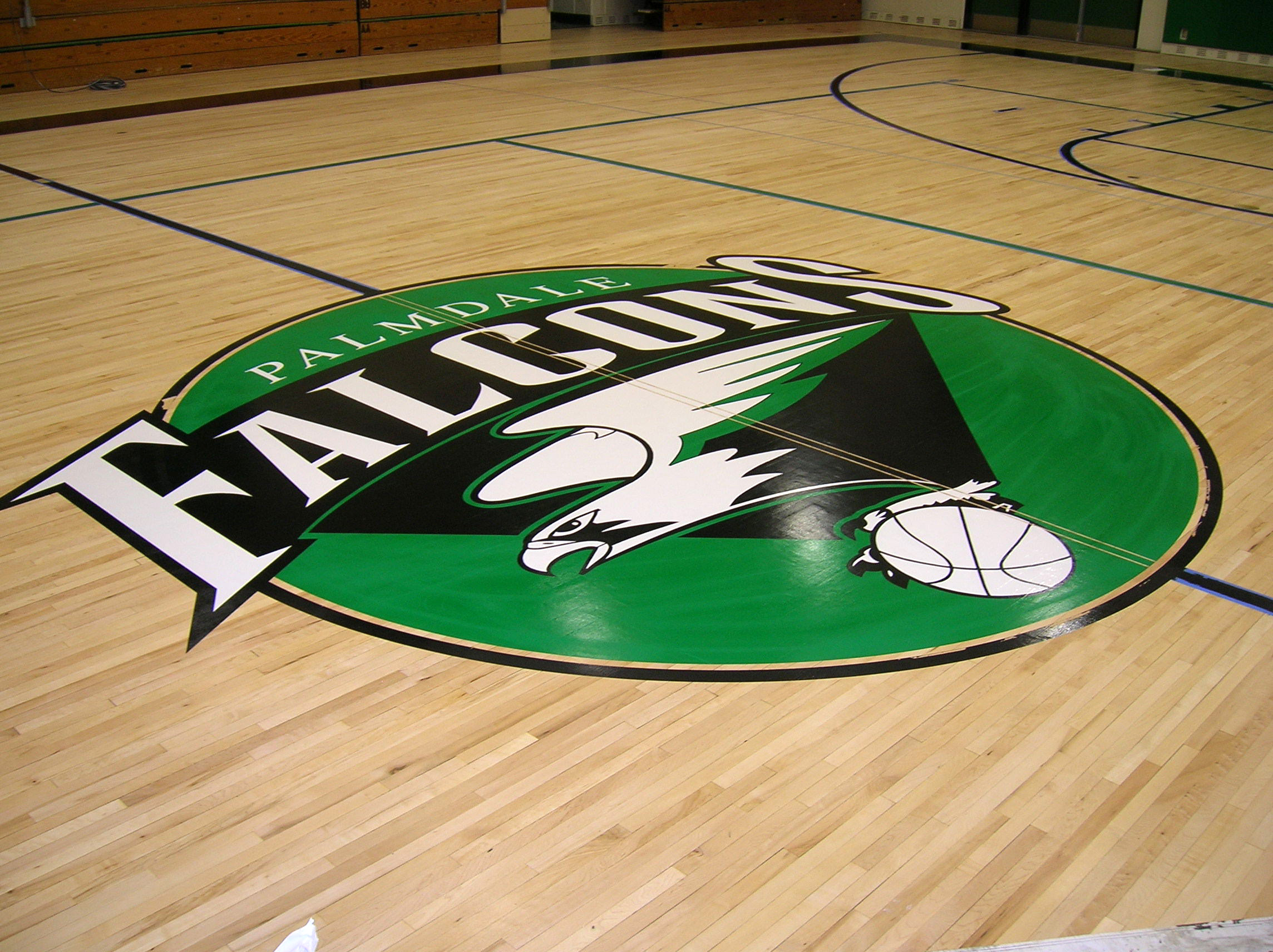 Palmdale High School gym wood floor hand painted graphics