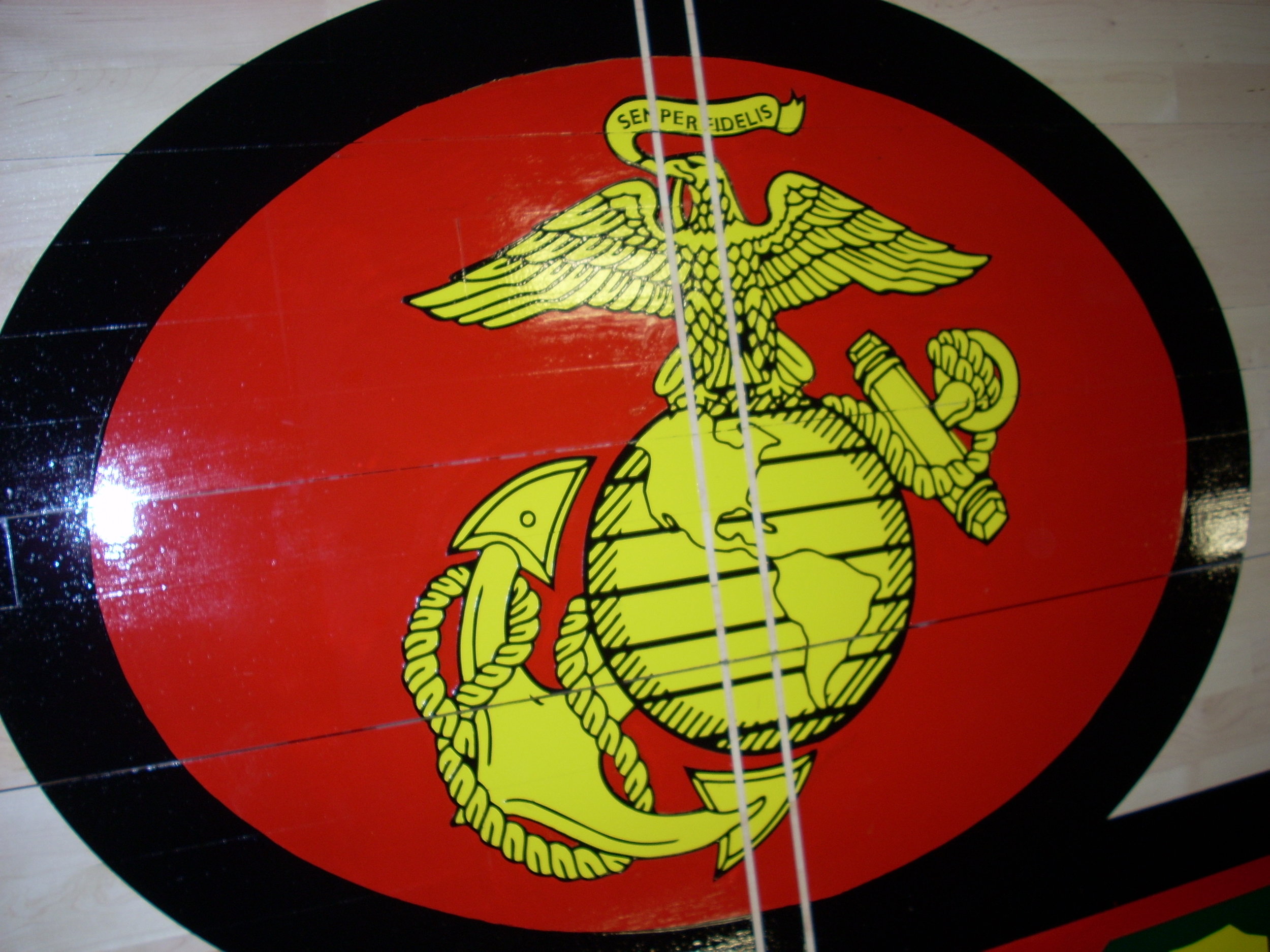 Fifth Marines gym wood floor hand painted graphics detail