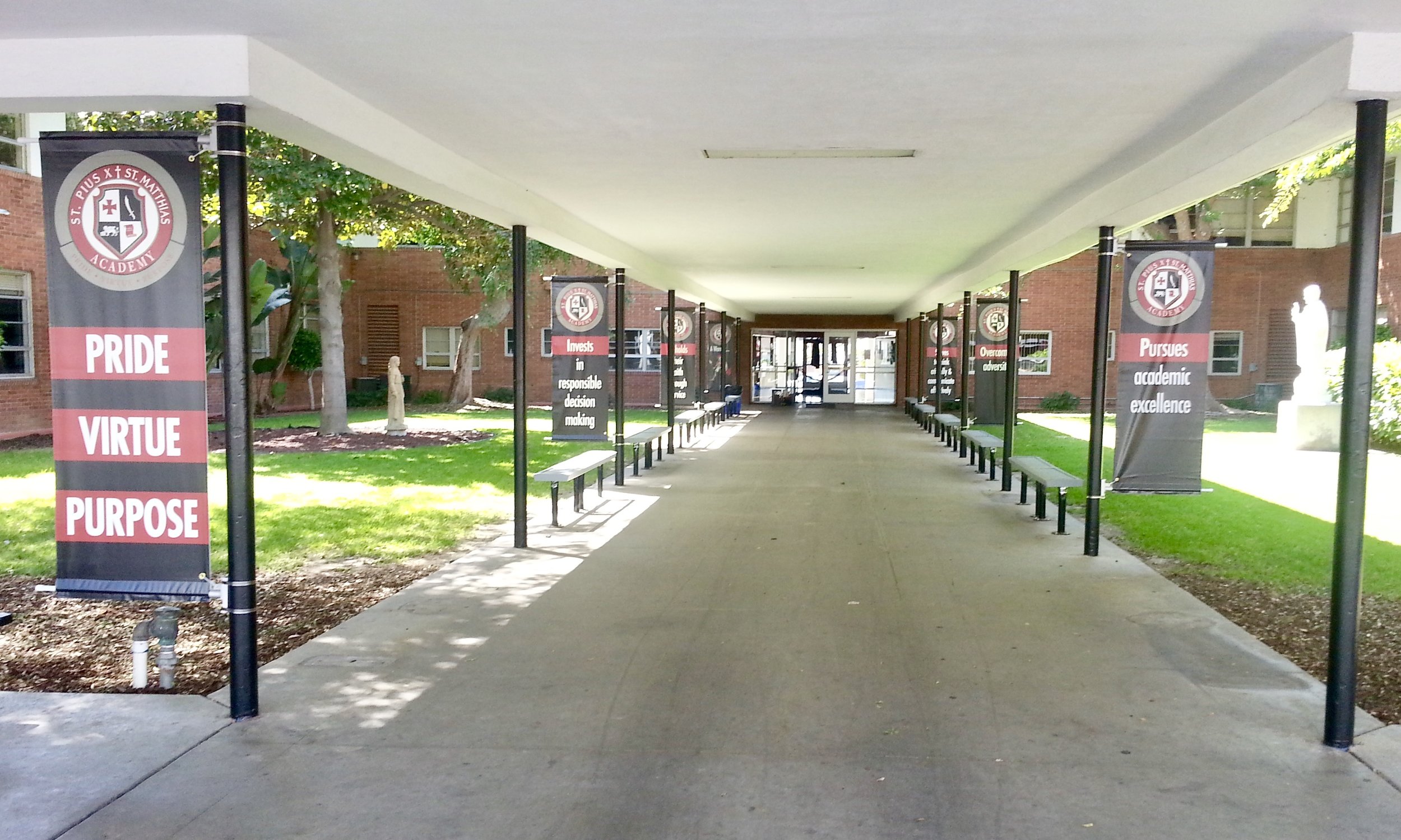 Pius Matthias Academy school spirit pole banners