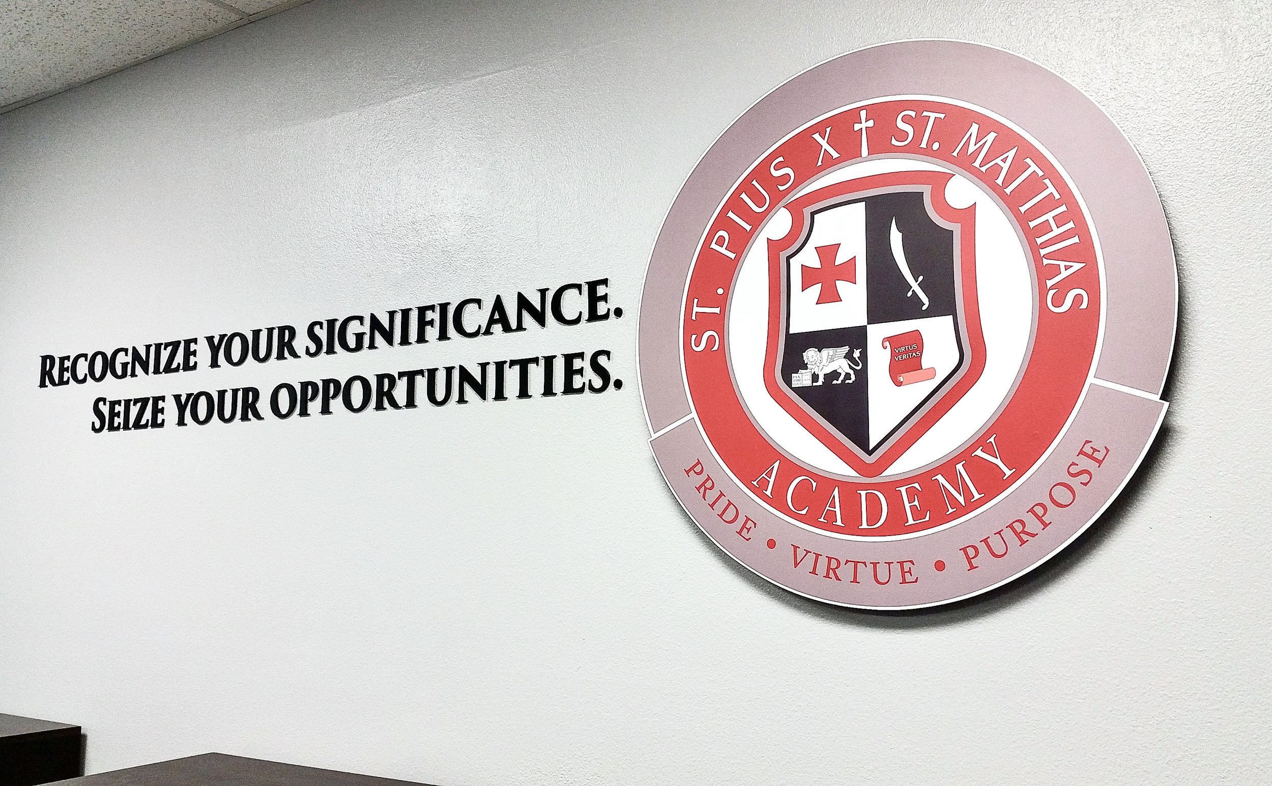 Pius Matthias Academy conference room dimensional logo and letters display