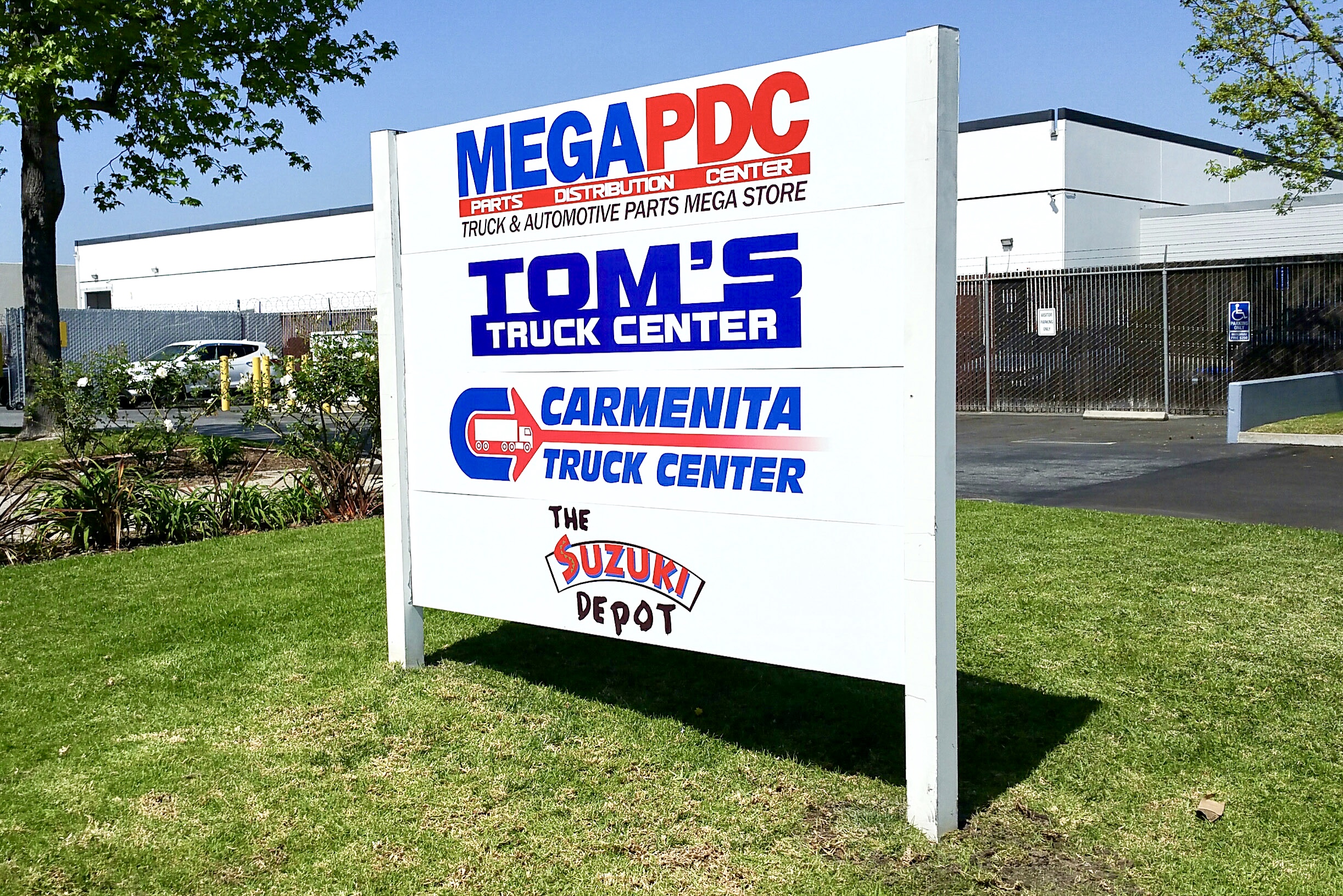 Tom's Truck Center post & panel sign