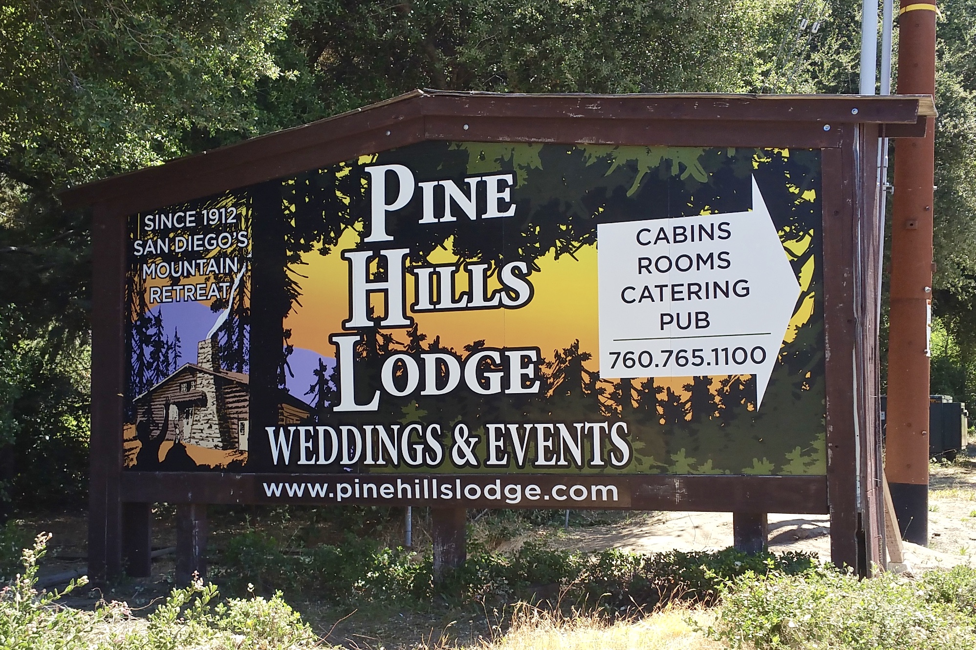 Pine Hills Lodge billboard monument sign