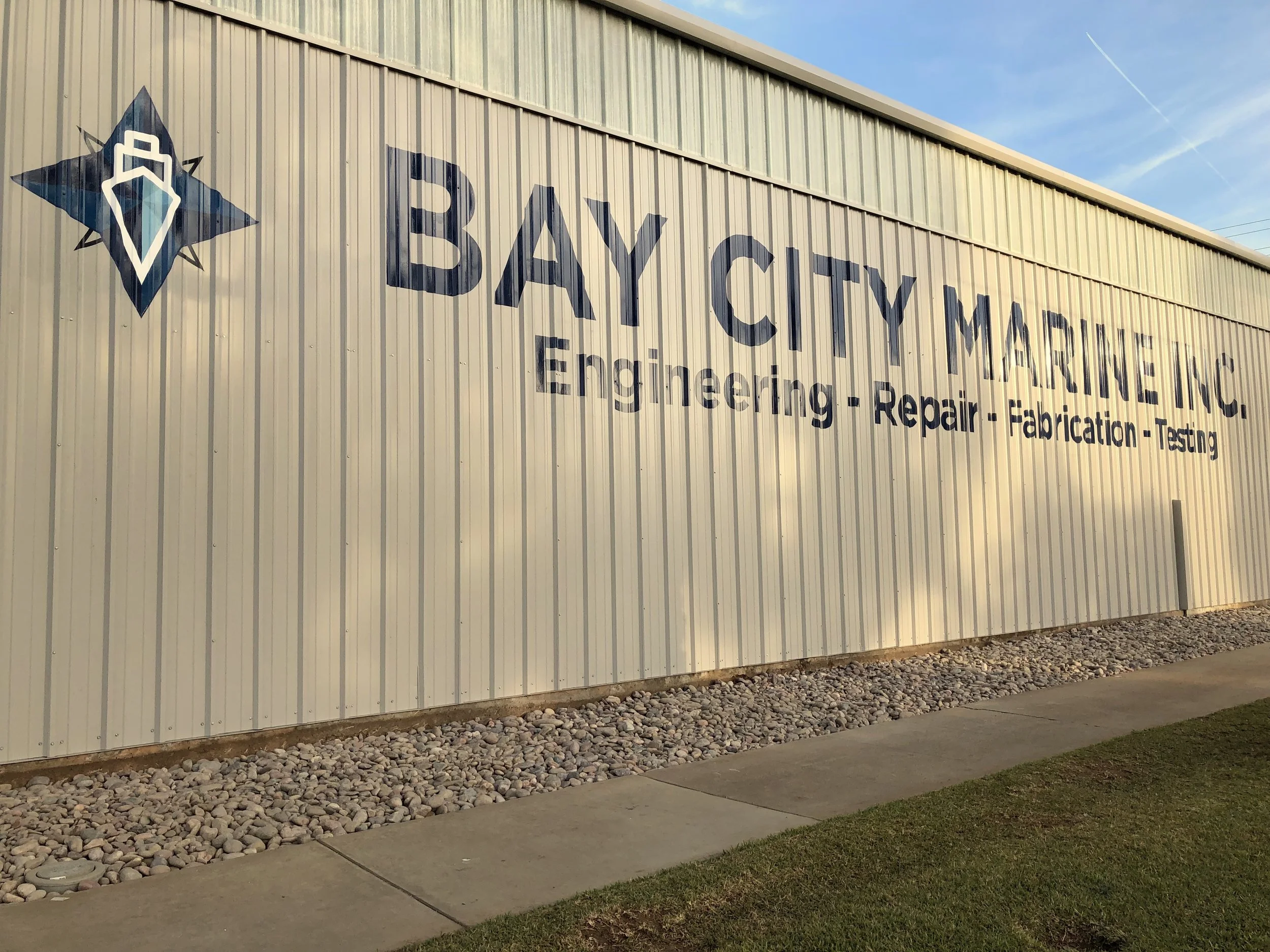 Recent work: hand painted steel building wall sign in San Diego area