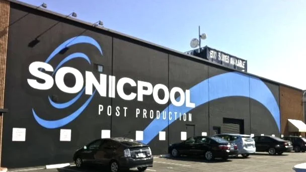 Hand painted building sign before and after: Sonicpool Post Production