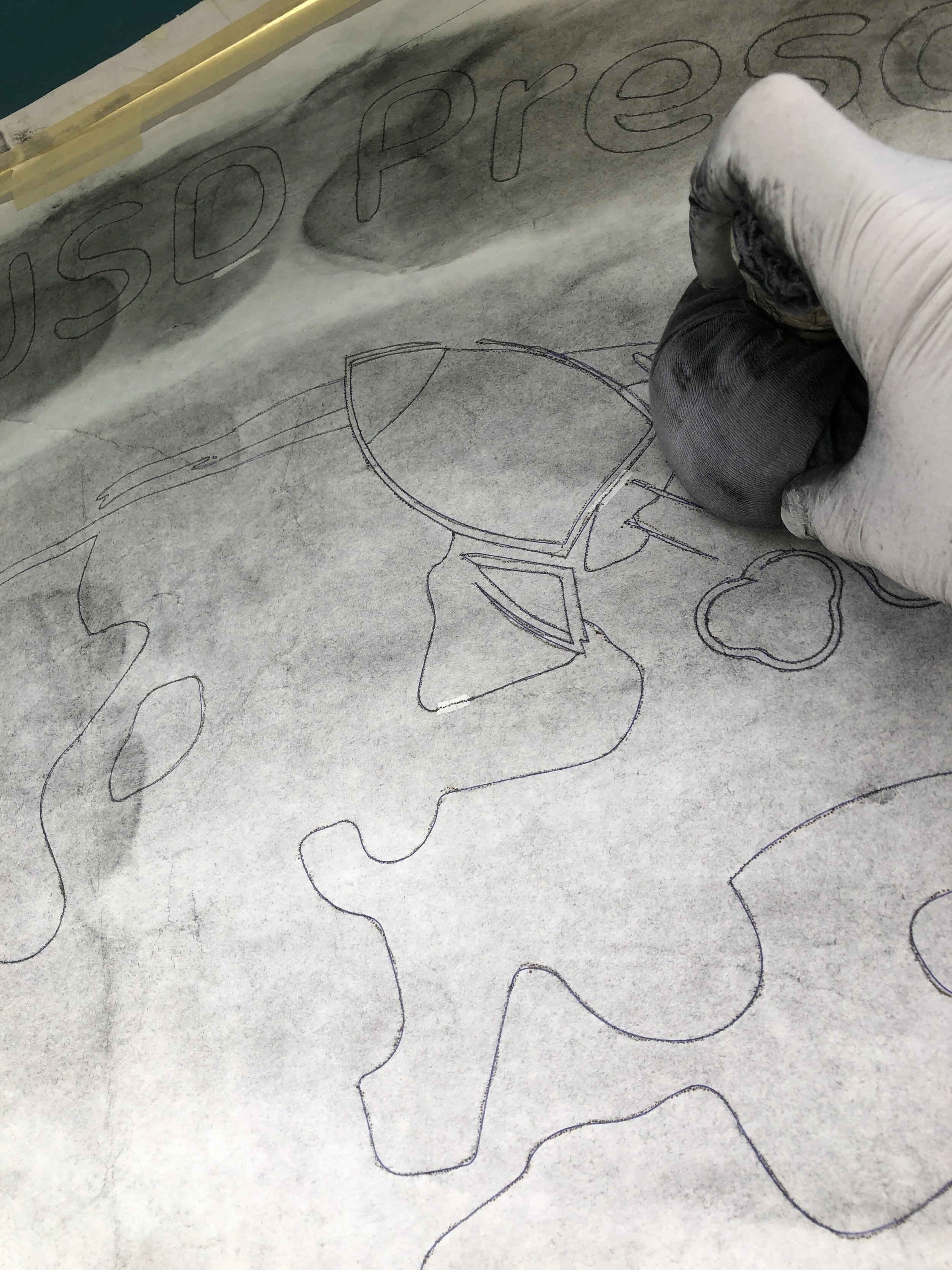 The sign painter pounce pattern - answering the question: "how do you get that design onto the building?"