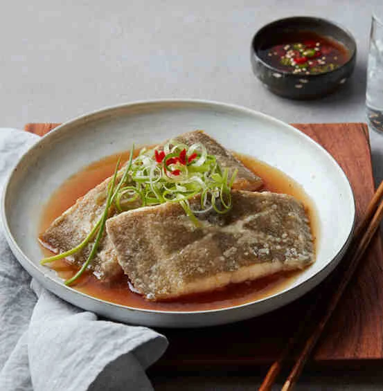  Korean Braised Fish with Green Onion Garnish. 
