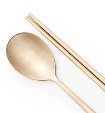Brass spoon and chopsticks.