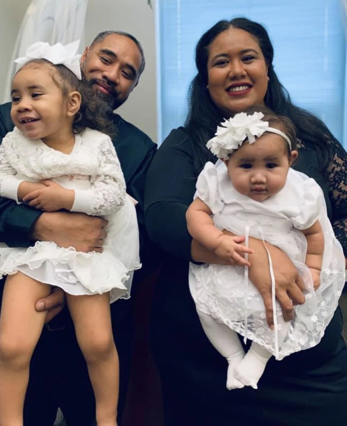 Esiteli with her husband and two children.