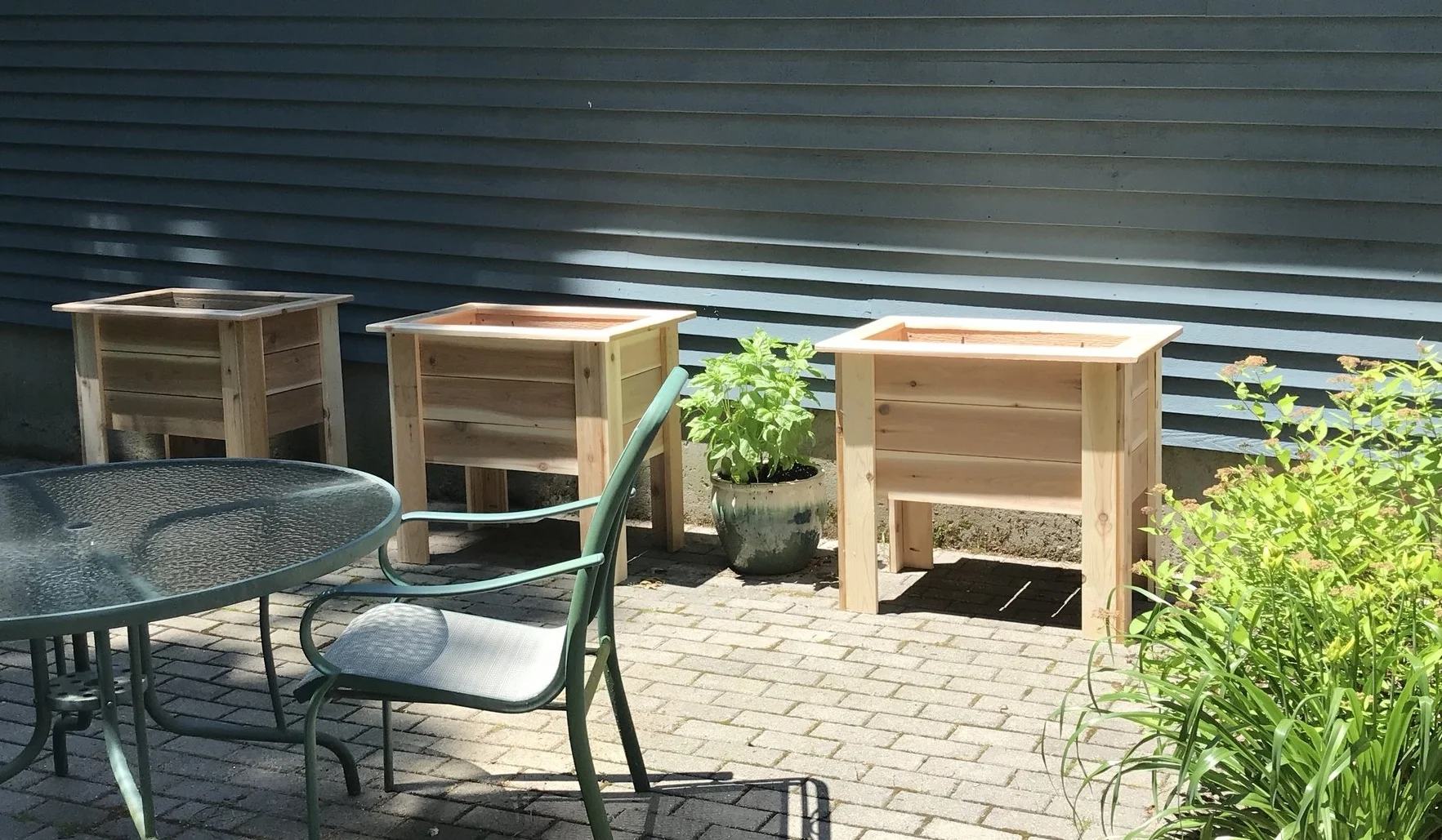 Three of the Patio Planters. All Cedar with rounded edges. All screws are stainless steel. Handmade in Madison, Connecticut.