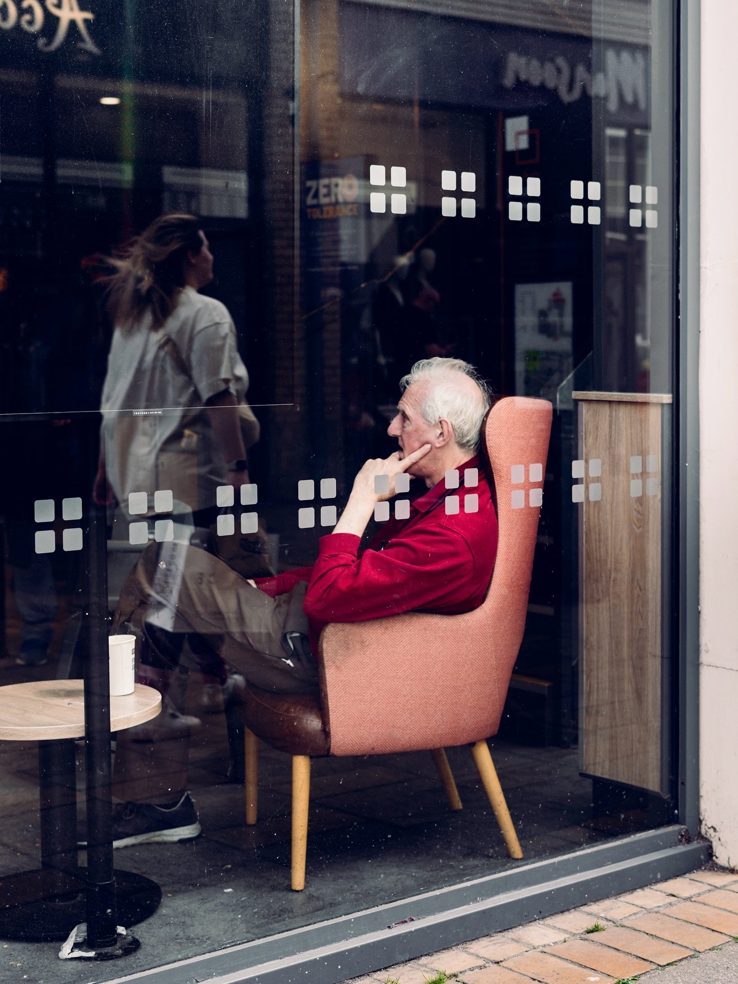 Inside, he holds a thousand stories. Outside, the city rushes past without asking.

#StreetPhotography #CandidMoments #UrbanSolitude #ThroughTheGlass #EverydayStories